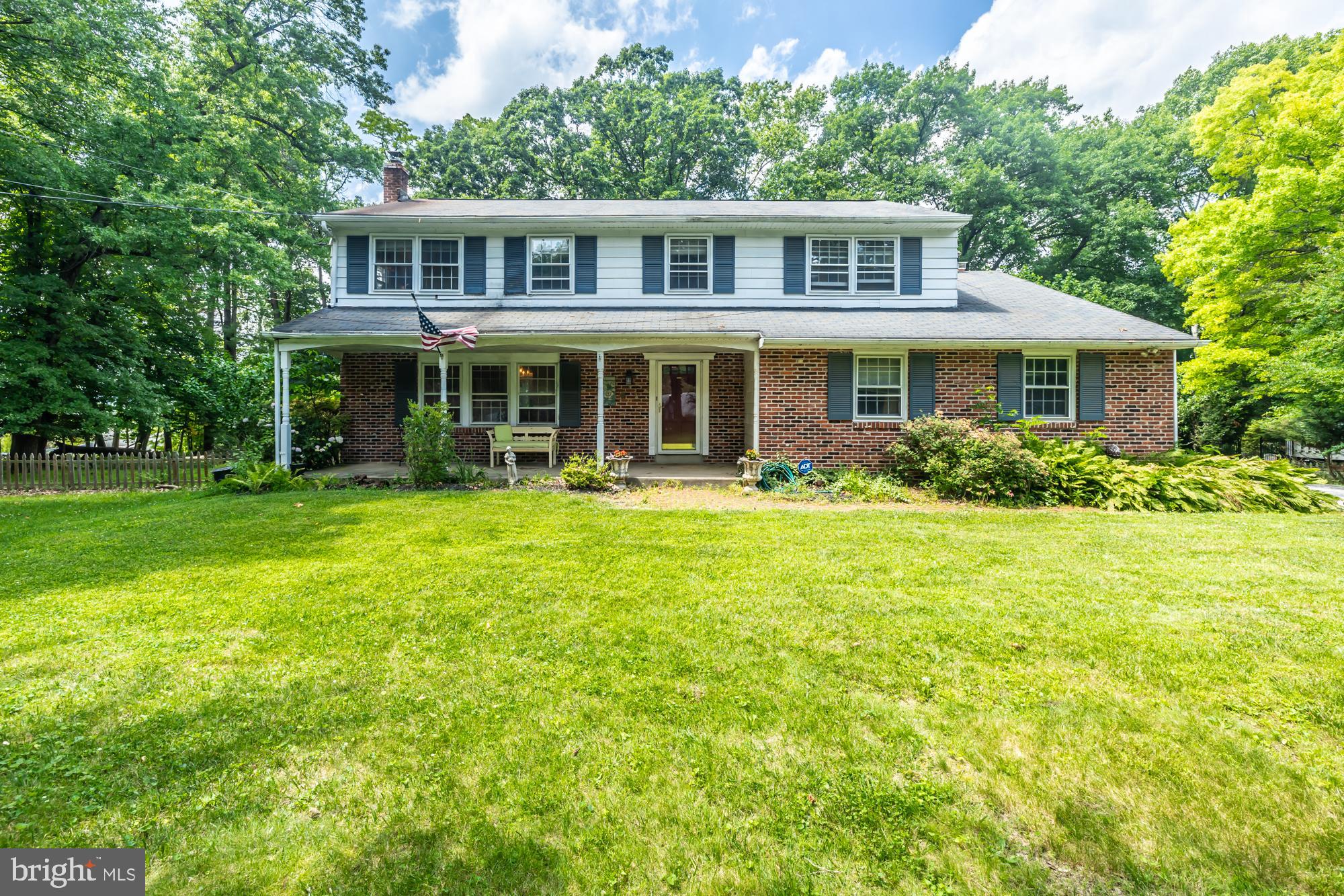 Set on a beautiful property in the highly acclaimed T/E School District, this spacious home offers a rare opportunity to create something truly special in one of Chester County's most sought-after locations. Featuring generous room sizes, hardwood floors, a private setting on nearly one acre, and a comfortable everyday floor plan, this home provides an exceptional foundation for customization and personalization. A freshly painted, two-tier deck extends the living space into the lovely backyard with private views. The main level features a kitchen with granite countertops, a large island, and glazed cabinetry that opens to a spacious family room with a wood-burning fireplace and direct access to the deck. Formal living and dining rooms provide excellent entertaining space, while a powder room and interior garage access add everyday convenience. Upstairs, the primary suite offers a large closet, laundry area, and private bath with a new oversized walk-in shower and vanity. Three additional bedrooms with hardwood floors share a generously sized hall bath. The finished basement provides valuable additional living space. Further improvements include the conversion to natural gas heating and installation of a new heater in 2019. Located just steps from Hillside Elementary School and approximately one mile from Conestoga High School, with easy access to the Daylesford train station, shopping, dining, and major commuter routes, this property offers exceptional convenience in the heart of Berwyn. Bring your vision and discover the remarkable potential this well-located Main Line property has to offer!