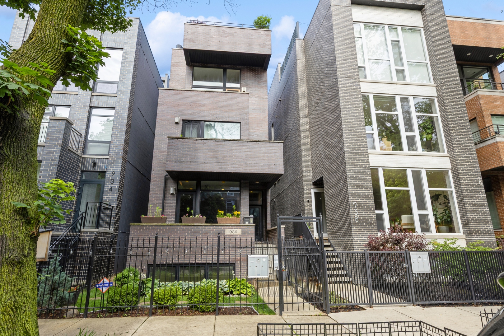 Welcome to this stunning duplex-down situated on a picturesque, tree-lined street in the heart of East Village; one of Chicago's most vibrant and sought-after neighborhoods. This beautifully maintained home is located in an all-brick, boutique building and offers the perfect blend of luxury, functionality, and comfort. Enter into the main level featuring a spacious, open-concept layout with ample room for both living and dining, plus a stylish powder room, making it ideal for entertaining. A cozy wood-burning fireplace anchors the living area, while oversized windows provide abundant natural light. Classically styled, upgraded chef's kitchen boasts premium Viking stove, fridge and Bosch dishwasher, sleek flat-panel cabinetry, granite countertops, and a breakfast bar-perfect for casual meals or morning coffee. From the main level, step out onto your large private deck, perfect for al fresco dining, relaxing, or entertaining. The lower level impresses with soaring 13-foot ceilings, radiant heated floors, and excellent natural light. This level offers a huge family room with direct access to a small private patio-ideal for a quiet retreat or a morning read. The luxurious primary suite includes a generous built-out closet and an elegant ensuite bath featuring dual vanities, a soaking tub, and a separate glass-enclosed shower. Secondary bedrooms are generously sized, making for great bedrooms, workout space or office. Hall bath is beautifully finished with gorgeous tiling and stand-up shower. Additional highlights include garage parking (included in the price), ample closet and storage space throughout, in-unit laundry, and high-end finishes that elevate the entire home. All of this is located in an unbeatable East Village location-steps from Wicker Park, Ukrainian Village, top-rated restaurants, trendy coffee shops, parks, public transportation, and everything the West Town area has to offer.