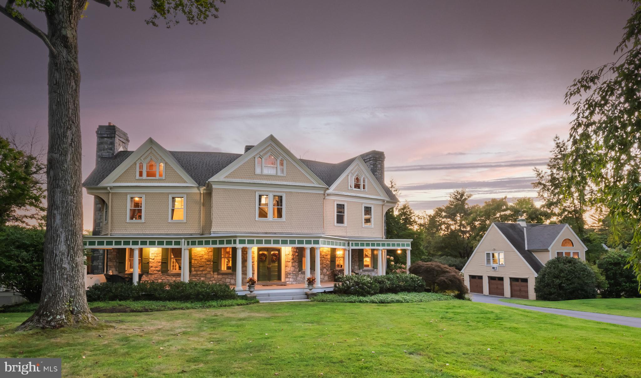 Welcome to 312 S. Waterloo Road, a truly magnificent home in the heart of Devon’s Estate Section. This exceptional, one-of-a-kind property must be seen in person to be fully appreciated. Its elegance, warmth, and timeless design—from the soaring ceilings to the meticulously crafted details in every room—simply cannot be captured in words. Schedule your private tour today and step into the grand entrance hall, where you’ll instantly know this is a truly special home unlike any other on the Main Line. It’s an often-used phrase, but in this case it’s true: this is indeed a once-in-a-lifetime opportunity! 312  S. Waterloo Road offers a seamless blend of Modern Expansion and Old World Charm—the absolute best of both worlds. The wrap-around covered porch sets the stage. Step inside to the breathtaking center entrance hall with its fireplace, gleaming hardwood floors and extraordinary hand-carved wood staircase rising three full levels. This staircase, crafted by artisans, is a true masterpiece. Throughout the home you’ll find incredible detailing and a warmth that blends elegance with comfort. The formal living room with a fireplace and the expansive dining room—also with a fireplace—are ideal for holidays and family gatherings. A tremendous family room addition with soaring tray ceiling and fireplace offers sweeping views of the grounds. The kitchen itself is the heart of the home, with a massive granite center island, abundant raised-panel cabinetry, generous counter space, tiled backsplash, and top-tier stainless steel appliances. Off the kitchen, a huge breakfast room with built-in bookshelves is filled with natural light. A true butler’s pantry connects the kitchen to the dining room for seamless entertaining. The classic English pub–style bar adjacent to the charming screened-in porch is the perfect spot to unwind with family and friends and take the edge off. Two powder rooms complete this level. Up the incredible staircase, the second floor features a sumptuous owner’s suite with fireplace, walk-in closet, additional custom closets, and an attached dressing room that could also serve as a nursery. The luxurious primary bath includes a marble double vanity and an oversized tile shower. A large second bedroom enjoys its own en suite bath, while a third bedroom—currently used as a home office—is served by a charming hall bathroom. This level also includes a full laundry room. The third floor offers two massive bedrooms serviced by a spacious full bath with a soaking tub and shower. Unlike most homes of this era, 312 S. Waterloo Road has a fabulous finished basement with full-size windows and direct access to the rear grounds and patio. Here you’ll also find a powder room, a true, fully conditioned wine cellar, and a very large unfinished storage area. Outdoor living spaces are equally impressive. In addition to the wrap-around front porch, there’s a screened porch off the bar area and a private patio in back—ideal for entertaining, quiet relaxation, grilling, and dining al fresco. And the bonus: above the three-car garage is a true one-bedroom apartment with a full bath, perfect for guests, extended family, or au pair accommodations. 312 S. Waterloo is an extraordinary Main Line classic. Every inch is a gem—more than words can capture here. Experience the perfect blend of luxury, comfort, and lifestyle—this is a home not to be missed. Close to the shops, trains, and restaurants of The Main Line, and located within the highly ranked Tredyffrin-Easttown School District. Check out the slideshow and video, or better yet set a private tour of this incredible home.  Seeing is believing.  Your search is over.  This is the one. Welcome home!