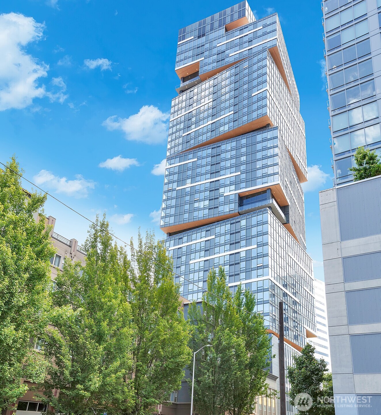 Welcome to elevated city living at Nexus — a smart, high-tech high-rise anchoring the heart of the Denny Triangle. Enjoy 24/7 concierge service alongside a Walk Score of 99 and Transit Score of 100 — steps from Amazon HQ, South Lake Union, Belltown, and everything downtown has to offer, car optional. Start the day with yoga, retreat to the co-working lounge on a rainy afternoon, or break a sweat in the fully equipped fitness center. Let the dog stretch its legs at the private dog run, then wind down grilling dinner on the sun-soaked rooftop terrace as the skyline lights up.    Perched on the 34th floor, this sun-drenched, south-facing residence is a rare floor plan— prized for its smart, efficient layout and oversized windows that flood the space with natural light. Take in sweeping views of the city and beyond from a home built for effortless, stylish living, complete with a custom home-automation system that streamlines your day-to-day.   24/7 concierge, three full floors of resort-style amenities, and building maintenance — true turnkey urban ownership.    Add unmatched walkability and effortless transit access, and you've got the full Nexus lifestyle — vertical living, evolved.