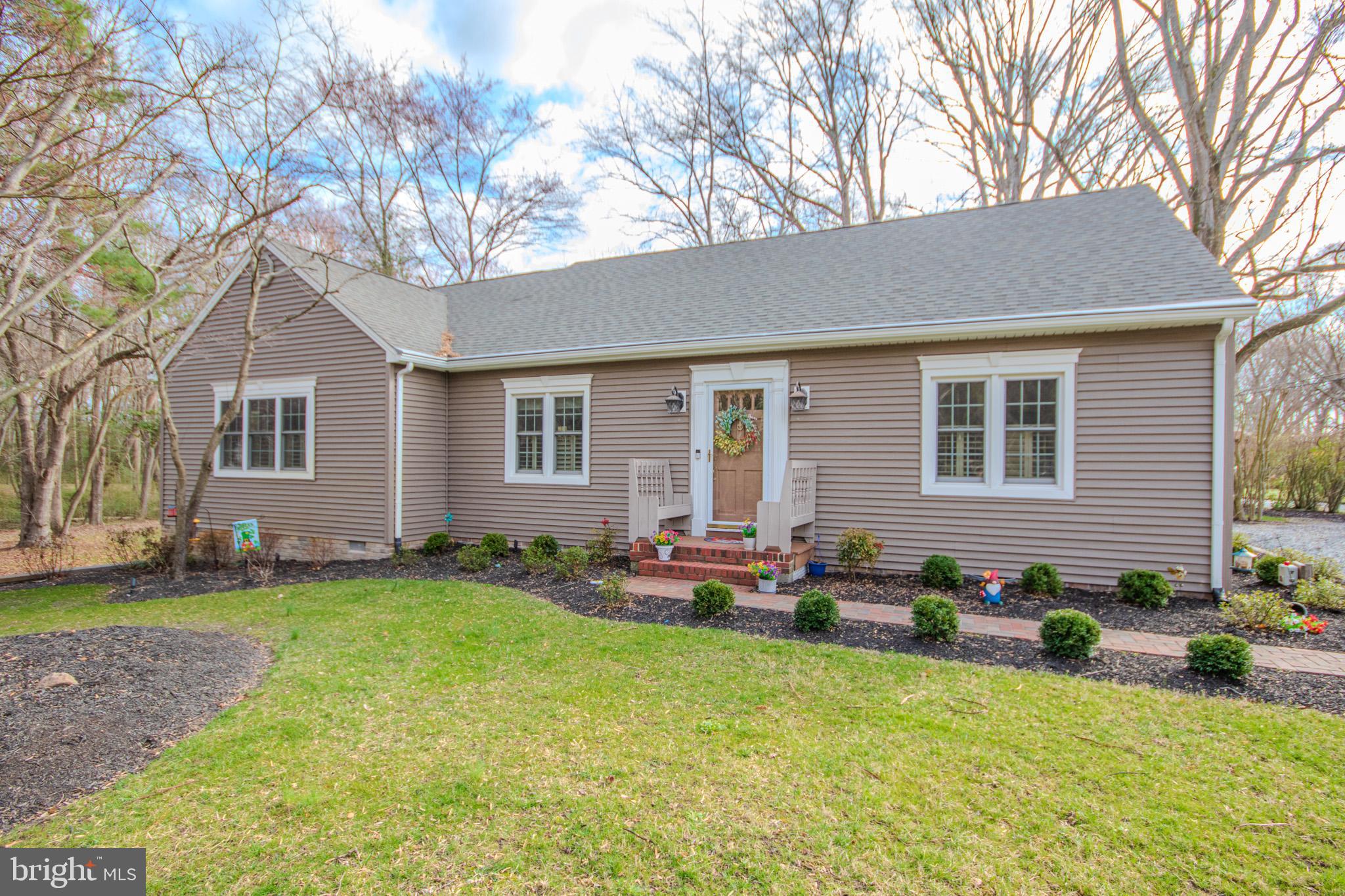 Welcome to 703 Parker Rd in Salisbury, a charming and spacious home set on 1.7 acres of beautiful property! A large foyer greets you upon entry, serving as the central hub of the main level and currently styled as a cozy sitting room. The thoughtfully designed kitchen features high-quality cabinetry, elegant Silestone countertops, terracotta tile flooring, and high-end stainless steel appliances. Through antique French doors, you’ll find a stunning dining room with a vaulted ceiling, exposed cross beams, and a full wall of custom built-in bookshelves, complete with a charming pot belly stove that adds warmth and character to the space. The expansive living area offers abundant natural light and ample space to relax or gather. The main level includes 2 bedrooms and 1.5 baths, while the upper level provides a 3rd bedroom, a full bath, and an additional bonus room that is ideal as a potential 4th bedroom, guest space, or flex room. Step outside to enjoy the beautifully landscaped 1.7-acre lot, complete with a lovely paver patio perfect for outdoor dining, entertaining, or simply unwinding in a peaceful setting. Added bones, this property offers outdoor landscape lighting that can be set on a timer. This unique property blends character, space, and functionality. It's ready to welcome you home! Schedule your private showing today.