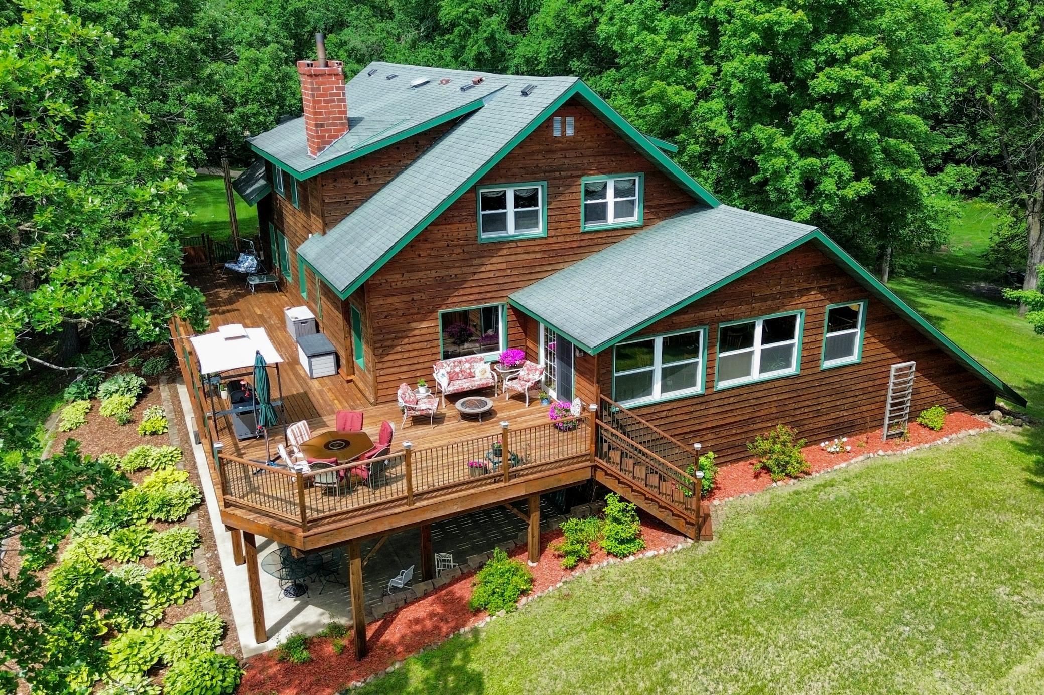 History and modern comfort come together in this former lodge turned lake home on beautiful Lake Koronis. Stunning views of the islands that crown the lake can be enjoyed from the expansive deck, front lawn, primary suite, and many other rooms throughout this one-of-a-kind property.The home features six bedrooms, each with its own private bathroom. The spacious lakeside primary suite offers breathtaking water views, a Jacuzzi tub, glass-enclosed shower, and an oversized walk-in closet. The upper level also includes a two-room en-suite bedroom and a third updated en-suite bedroom.A remarkable 70.5-foot wraparound deck spans the lakeside of the home, providing exceptional space for entertaining or relaxing. Sliding glass doors lead to a bright sunroom-style dining and sitting area overlooking the lake, while double doors open to the kitchen and living room featuring a wood-burning fireplace. The main level also includes another two-room en-suite bedroom and an additional en-suite bedroom.Above the garage, a large bonus room offers endless possibilities as a home office, recreation room, or studio. The lower level features the sixth bedroom in an apartment-style setting with a private living area and updated bathroom. Also on the lower level are a spacious family room with a wood-burning fireplace, half bath, and beautiful lake views, plus an additional sitting, media, or recreation room. An insulated attached two-stall garage with in-floor heat completes the home.Set on 232 feet of shoreline, this historic property enjoys frontage on Lake Koronis, Stearns County's largest lake at approximately 3,000 acres. Known for excellent fishing and year-round recreation, the lake also features three public parks and a paved biking and walking trail that circles the entire shoreline and connects to a larger regional trail system.Conveniently located just minutes from dining, golf, a brewery, grocery shopping, bowling, and other local amenities, this property offers a rare opportunity as a spacious year-round residence, gathering place for extended family, or potential vacation rental investment. Schedule your private showing today!