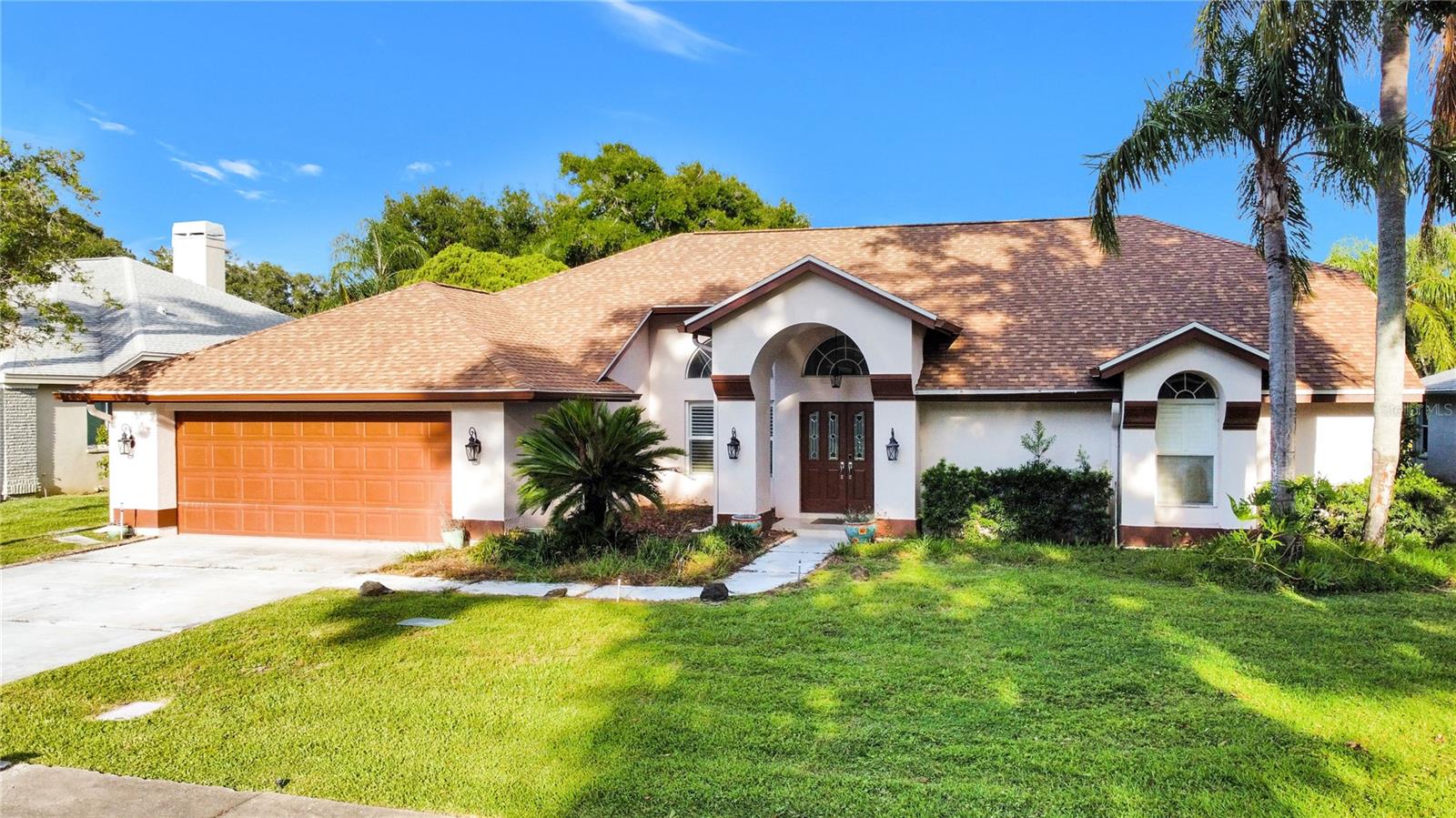 **PRICE IMPROVEMENT**SELLER'S ARE VERY MOTIVATED! Nestled in the highly sought-after Lansbrook subdivision, this beautifully updated home provides a luxurious living experience. With its four spacious bedrooms, three bathrooms, and almost 3,000 square feet of living space, this home is ideal for a growing family. Upon entry, you’ll be greeted by an abundance of natural light, high ceilings, and a formal living room/dining room combo with sliding glass doors offering easy access to the pool area. The seamless flow of this home will bring you to the spacious, elegantly designed kitchen with granite countertops, stainless steel appliances, and a extra large island with high top seating that's ideal for entertaining. The family room is adjacent to the kitchen, which has large pocket sliding doors that lead to the pool area. Boasting a split floor plan, you’ll find three guest bedrooms and two guest bathrooms off of the family room, with the spacious primary bedroom situated on the opposite side, providing the perfect blend of privacy & quiet. This personal sanctuary features sliding glass doors that lead out into the pool area, offering a seamless connection to the outdoor space. A large walk-in closet, ensuite bathroom with a separate shower and bathtub as well as a double sink vanity. When you step outside, you’ll find a fully enclosed tropical oasis...showcasing a large pool deck with a custom outdoor kitchen equipped with a wet bar and sink, a stunning crystal clear pool with a separate spa. Conveniently situated on a preserved pond lot provides the added bonus of no rear neighbors. Some of the many upgrades include a NEW ROOF installed this year, a resurfaced pool in 2020, painted garage floors in 2022, HVAC 2021.Lansbrook offers a variety of amenities for the residents including a picturesque lakefront park, a boat ramp providing access to Lake Tarpon, a fishing pier, a walking path, and the Commons Park. This park offers basketball courts, a full-size soccer field, and a playground. The community is also home to top-rated schools, making it conveniently located near shopping, restaurants, the YMCA, the county library, and John Chestnut Park. Don't wait, schedule your private showing today, you'll be so happy you did!