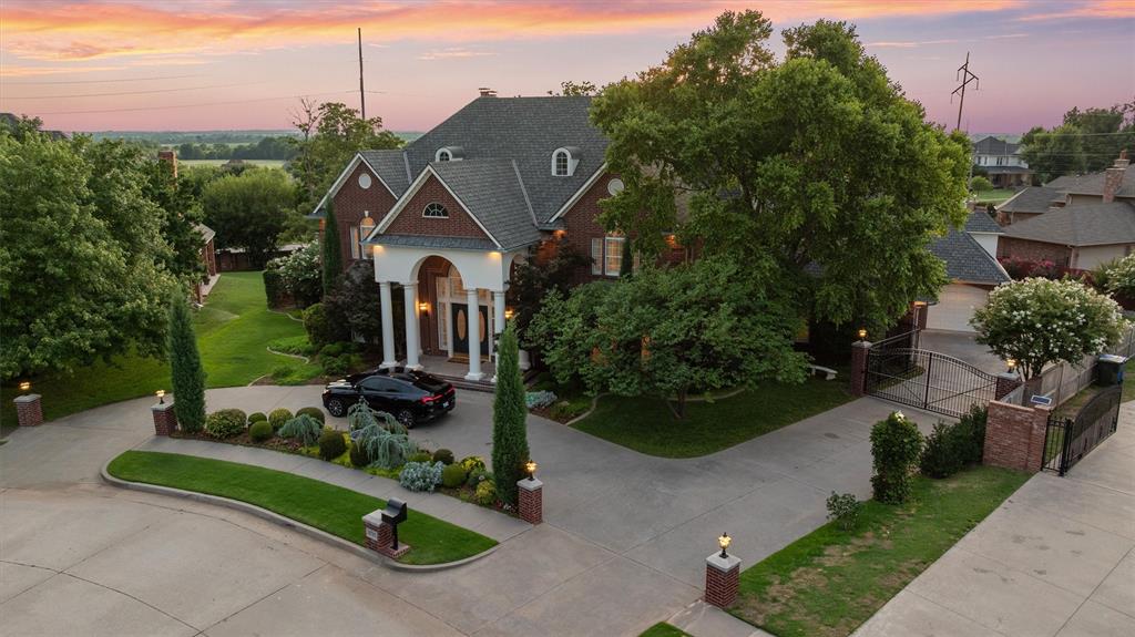 Welcome to one of the most iconic homes in West Norman, ideally located on a tree-lined cul-de-sac in the prestigious Brookhaven neighborhood. Set on nearly three-quarters of an acre, this stately residence offers timeless curb appeal, with grand columns and a dramatic dual curved staircase that makes a lasting first impression the moment you arrive. Inside, you’ll find grand scale and thoughtful updates at every turn. The light-filled main living room features a soaring two-story ceiling, an elegant fireplace, and a wall of windows overlooking the newly resurfaced pool and spa—perfectly blending everyday comfort with statement-making style. Designed for effortless entertaining, the home offers wet bars on both levels, multiple living and dining areas, and seamless indoor-outdoor flow. The updated kitchen is both refined and functional, featuring granite counters, crisp white cabinetry, and a new tile backsplash. The private primary suite is tucked away on the main level with tranquil views, a spacious layout, and a spa-inspired bath. Each secondary bedroom offers its own bathroom access, ensuring comfort and privacy for family and guests alike. For those who love to entertain outdoors, a dedicated bathroom with a built-in sauna is easily accessed from the backyard. With new flooring, fresh paint, updated lighting, and thoughtful upgrades throughout, this home perfectly balances timeless elegance with modern living—all just minutes from I-35, Brookhaven Village, and top-rated schools. Schedule your private introduction to this remarkable home.