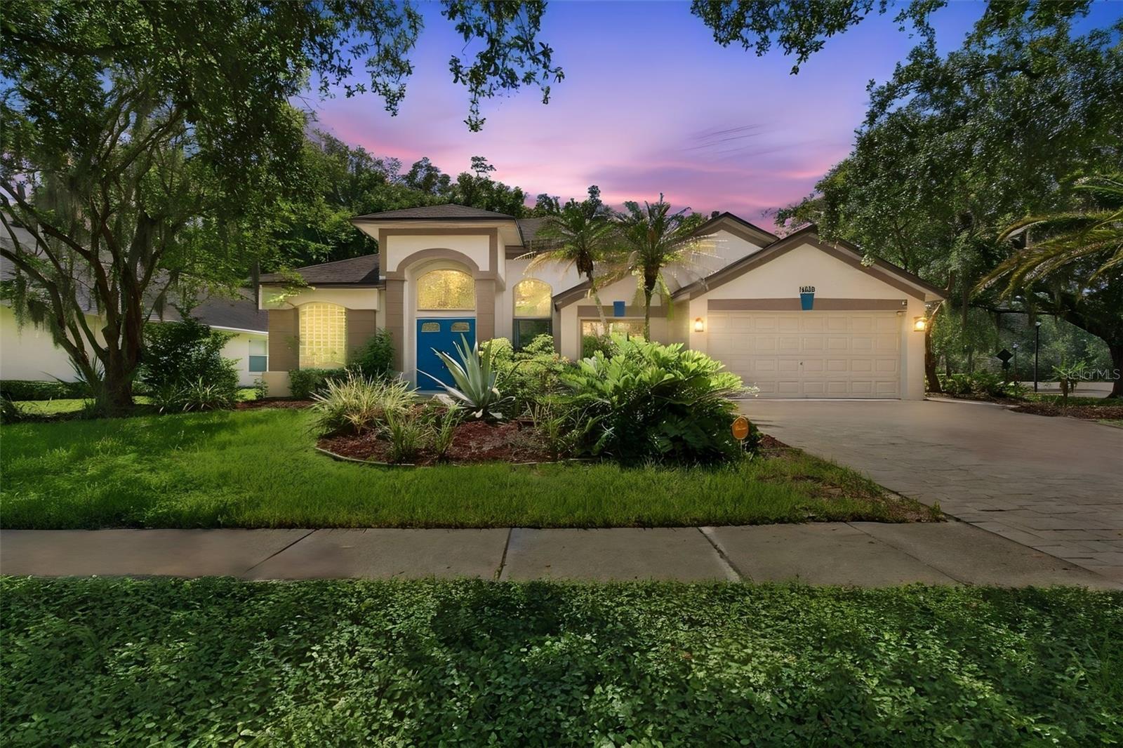 Welcome to this beautifully updated and meticulously maintained pool home, ideally situated on a desirable corner lot in the highly sought-after community of Tampa Palms. Thoughtfully designed for comfortable living and entertaining, this spacious residence features a split-bedroom floor plan, stylish marble-look laminate flooring, and a beautifully renovated kitchen with updated cabinetry, countertops, and a gas range.This home is filled with unique custom features, including two completely concealed doors in the family room. The hidden door to the left of the electric fireplace opens to a beautifully customized laundry room—you would never know it was there until the door was opened. To the right, another secret door leads to a private bedroom and pool bathroom, creating an ideal second primary suite, guest retreat, or secluded living space.One bedroom has been transformed into an impressive custom closet and dressing room. Buyers may choose to keep this luxurious space as-is or have the sellers remove the closet system and restore it to a traditional bedroom. Just inside the home from the garage, the versatile bonus room is perfect for a home office, hobby room, or additional living space and includes another unexpected feature—a hidden closet tucked discreetly behind the bookshelf.Step outside to your private backyard retreat, beautifully positioned on the corner lot and surrounded by a peaceful conservation setting. The outdoor space features a heated saltwater pool and spa with color-changing lighting, a resurfaced pool finish, and plenty of room to relax or entertain while enjoying exceptional privacy.Tampa Palms is known for its excellent schools and exceptional community amenities. Sidewalks and scenic trails wind throughout the neighborhood, while nearby recreational amenities include a community park, playground, tennis courts, and basketball courts.Additional highlights include newer windows and sliding glass doors, a gas water heater, and distinctive custom details throughout. Lovingly cared for and exceptionally well maintained, this one-of-a-kind home reflects true pride of ownership and offers an unforgettable combination of comfort, privacy, character, and the sought-after Tampa Palms lifestyle.