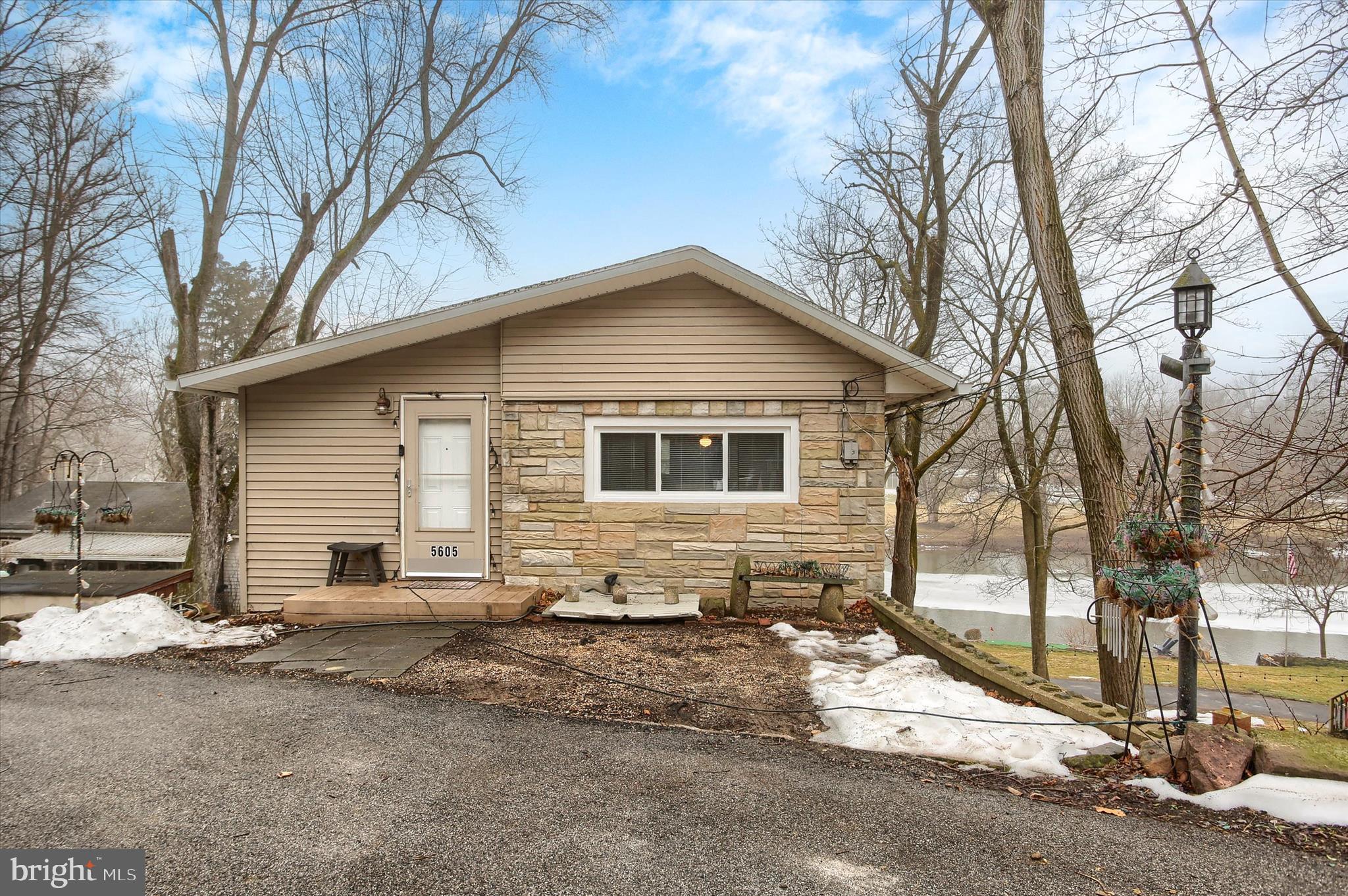 Enjoy breathtaking views of the Conodoguinet Creek from this beautifully remodeled waterfront home. Originally built in 1940 and completely transformed in 2024/2025 this one-of-a-kind property blends timeless character with thoughtful updates. Recent updates include-new water heater, new well pump, 2 mini splits, 10 new windows, ceiling fans,  new appliances, new kitchen sink & faucet, garbage disposal, new bathroom vanities, new toilet, new stairways railings, new front door with keyless entry, new drywall and trim, fresh paint, "salon sink" added to mudroom/laundry area, new flooring, gutters and more....Complete with one car garage, direct creek access, this home delivers the ultimate waterfront life! Can be an investment opportunity for short-term rentals or your own peaceful getaway. Conveniently situated in desirable Hampden Twp, you're just moments away from shopping and restaurants. Quick access to 581, and 81 makes commuting a breeze! NOT IN A FLOOD ZONE!