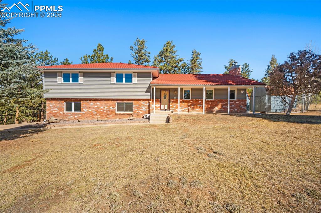Beautifully maintained & extensively upgraded, this spacious home sits on a rare .82-acre in-town lot in Woodland Park, offering privacy, usable space, & easy access to schools, shopping, trails, and daily amenities. The upper level features a spacious primary suite w/ attached bath, plus two additional bedrooms w/ walk in closets and a full bathroom. The remodeled kitchen offers quartz countertops, new cabinetry with pull-out drawers & soft-close doors, updated sink, newer appliances, abundant storage, breakfast nook, & separate formal dining room. Natural light fills the main living room w/ a gas brick fireplace & French doors, while the office/den includes a free-standing gas stove & walkout access to the fenced backyard. The lower level includes a 4th bedroom w/ adjoining bath, ideal for guests or privacy, plus a family room w/ a second brick fireplace and large storage closets. Recent upgrades include three updated bathrooms, newer flooring on three levels, Renewal by Andersen windows, new blinds, fresh interior paint, upgraded electrical panel, whole-house radon mitigation system, whole-house water filter. Major mechanical updates include a new boiler furnace system with on-demand hot water heating. along with recently cleaned fireplace chimneys and gas stove. Outdoor features include a walk out to patio for the BBQ's, walkway, gazebo, swing, gas grill, two storage sheds, level RV parking.  fenced area for pets. No HOA allows flexibility for extra vehicles and recreational equipment. Fire mitigation has already been completed with tree thinning, vegetation clearance, deck screening, decorative stone, and drainage improvements. Metal roof & aluminum siding add durability & fire-conscious value. Additional highlights include a south-facing concrete driveway, insulated interior walls, attic insulation, & underground drainage piping. A rare in-town Woodland Park property offering space, upgrades, & move-in-ready mountain living.