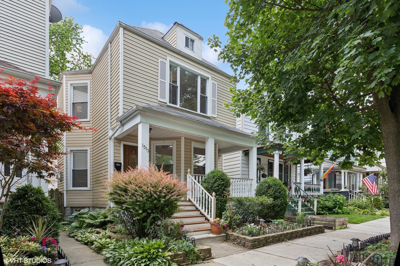 Come home to a perfect Edgewater 3 bedroom, 2.5 bath home with a fenced back yard and large deck, and 1.5 car garage with electric charging station, all nestled on a beautiful tree lined block on Highland Ave. This classic charmer has a great front porch, all newly painted and detailed, that opens into a large living room framed by a gas fireplace on one side, and a gorgeous staircase leading to all three bedrooms on the second floor. Bay windows bathe the main level with lots of natural light. The chef's kitchen has gorgeous granite, a large island with breakfast bar, and stainless steel appliances, including a wine fridge. The dining area, with a skylight adding beautiful exposure, opens on to a spacious deck, perfect for your entertaining and barbeques. Three bedrooms up are all good sized, with nice closets. The second floor full bathroom is all new, redone just before market. The second full bath is in the lower level with a large marble jacuzzi. This fully finished lower level offers plenty of additional flexible space for play, or a home office. A laundry and utility room adds organization and storage. Dual zoned HVAC systems were both replaced just 2 years ago, as well as a water heater only 1 year old. A large unfinished attic offers amazing potential for expansion. This special home was fully repainted, the hardwood floors were refinished on the entire main level, front porch and back deck were power washed and painted, as well as the full upstairs bathroom renovation. This is the one! All this is just steps from Devon Market, Starbucks, Clark/Devon Hardware, Clark St bus, and the Loyola el stop.