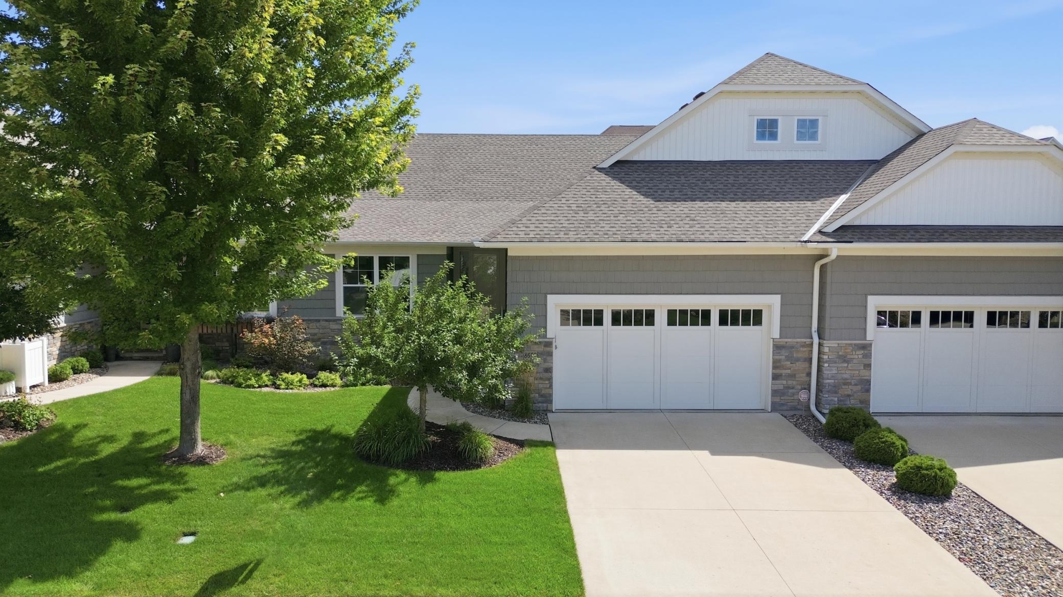 Welcome to Lakeside at Lake Riley, where every detail of this custom Wooddale Builders home was designed to make life a little easier and a lot more enjoyable! This highly desirable community offers main level living at its finest along with resort-style amenities, including a private clubhouse, outdoor heated pool, party room, fitness center, beach, dock, lake access and pontoon rentals. This townhome boasts three bedrooms and three bathrooms across 3,160 finished square feet. Gorgeous hardwood floors guide you past the home office. The gourmet kitchen features a center island, designer tile backsplash and stainless-steel appliances. Entertain in the spacious dining room or in front of the living room fireplace. Completing the main floor is the sunroom, screened porch, primary bedroom with full bathroom, and laundry room. The walkout lower level showcases the family room, flex room, and two bedrooms with an adjacent three-quarter bathroom. In addition to the community amenities, enjoy easy access to trails, parks, award winning golf courses and nearby downtown Chanhassen.