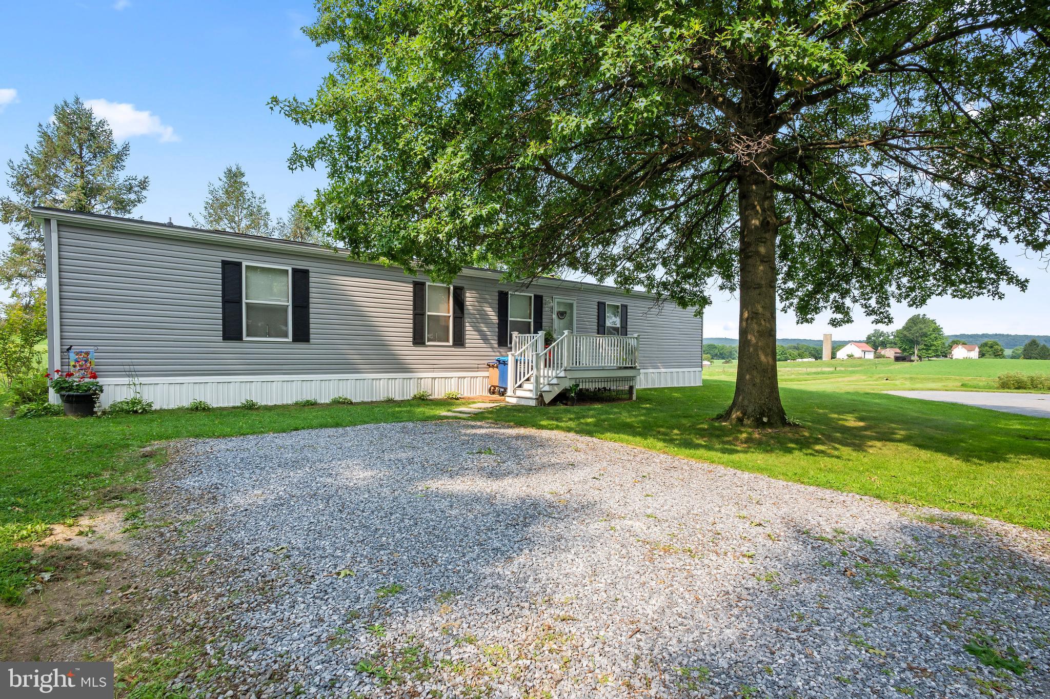 Welcome to 334 Grubb Drive in Elverson, PA, located within the Twin Valley School District. Built in 2022, this well-maintained 3-bedroom, 2-full-bath home is situated on an end cul-de-sac lot, offering privacy and beautiful views of the surrounding rolling farmland. The home has been lovingly cared for and features a spacious primary bedroom with a private en-suite bathroom. Enter through the front door to an open concept layout that flows between the living area and kitchen. Several newer improvements add to the appeal, including a new roof in 2022, new hot water heater in 2023, new AC unit in 2023, and a beautiful screened-in-porch installed in 2023 - this is the perfect spot to enjoy your morning coffee while taking in the peaceful views and open surroundings. Outside, the property offers a large yard with plenty of room to enjoy the outdoors, along with a nice-sized storage shed that provides convenient space for lawn equipment, tools, and other belongings. Loag’s Corner is an all-age community with an affordable monthly lot rent of $525, which includes water, sewer, and trash services. Move-in ready and waiting for its next owner, this home offers comfortable community living with a private setting, scenic farmland views, and inviting outdoor space.  Don’t wait—schedule your showing today and make 334 Grubb Drive your next home!