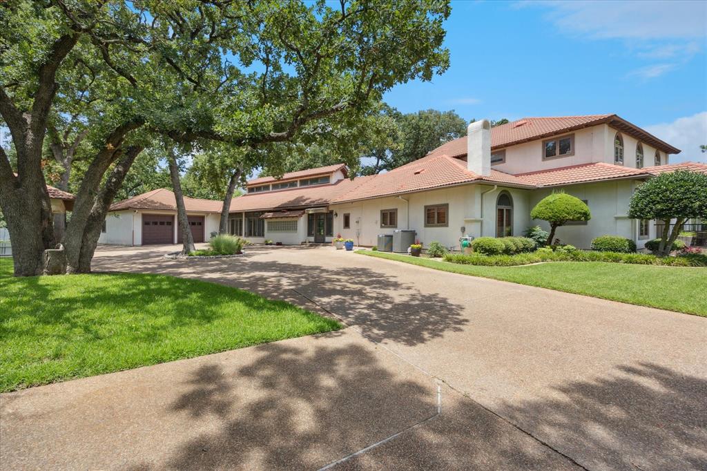 This is an amazing opportunity to own a large home, barn and over 8 acres in Arlington! There are so many wonderful things about this home including 4 bedrooms each having their own bath! The floorplan includes A wonderful primary bedroom with the most unbelievable closet and spa-like bath you will ever see! The primary suite includes his and her sections with amazing storage and 3 closet areas. On the main level you also have a chef's kitchen with two oversized pantries, coffee bar, beautiful cabinetry,  oversized built in refrigerator , copper farmhouse style sink and  copper vent a hood plus two more utility sinks and much much more. You will also find an office with very nice built in cabinets and desk, a separate den with built in cabinets which makes a great TV room or used for multiple purposes. The Bar area which could seat at least for and it includes a wine cooler that could hold 80 bottles of wine, sink and shelving for glassware and an area that would be great for a game table. The beautiful staircase leads you to the 2nd level where this a large game room with bar area,  3 bedrooms and 3 baths. All are good sized rooms and great for the family! A spiral staircase leads you up to the 3rd level which could be used for a variety of purposes such as play, work or additional large storage closet. There is a small balcony off of this area which overlooks the beautiful grounds. On the rear of the property, you will find the barn which has been used as a workshop and it also features horse stalls. You will also find that barn includes a small apartment. In addition to the barn, you have beautiful grounds, gazebo with a fireplace several patio areas and the indoor pool with diving board, spa, built in grill and small refrigerator and pool bath.  Please see additional remarks in supplements.
