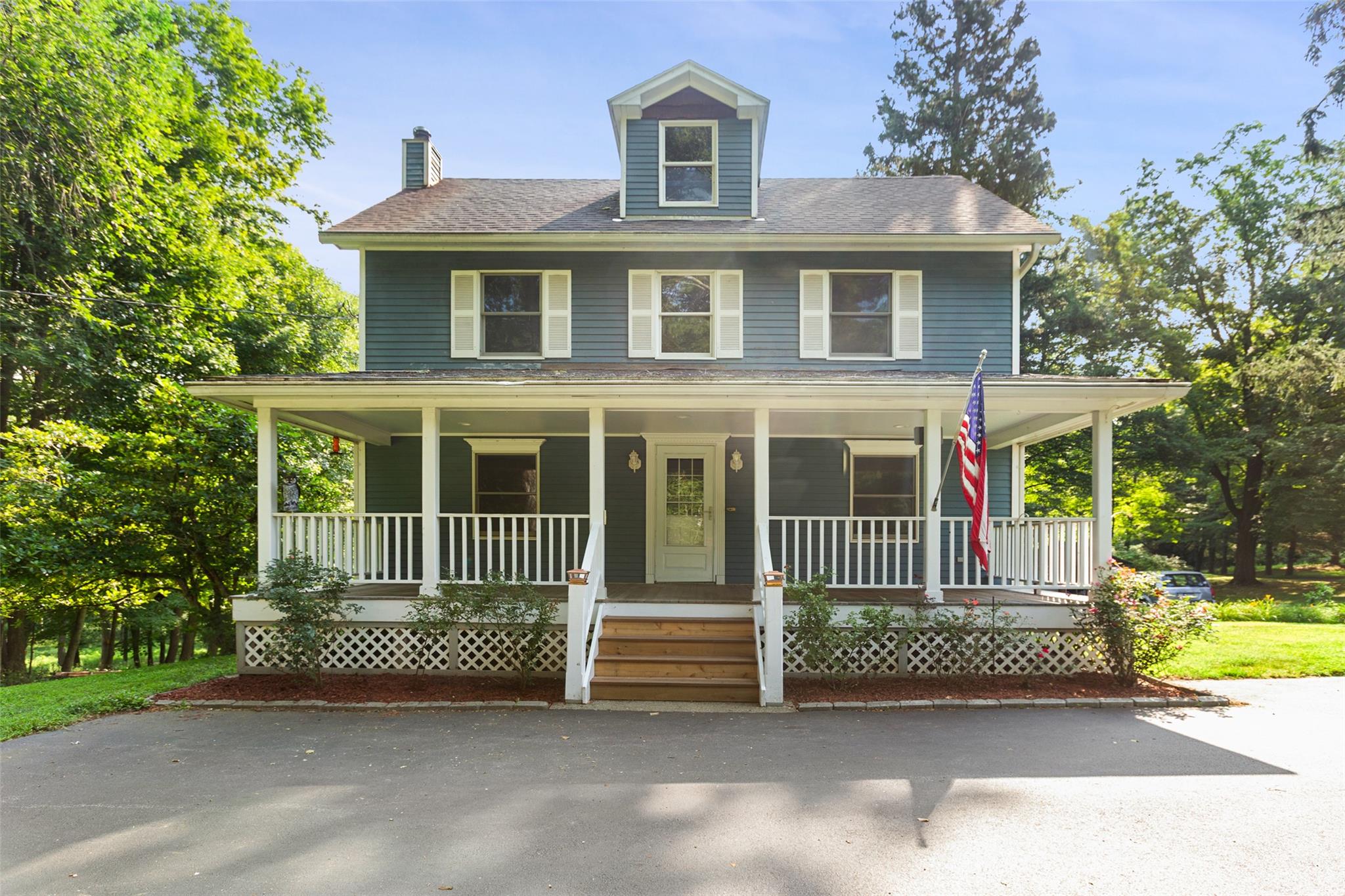 Welcome to this charming 1925 Colonial set on over 2 acres of scenic, park-like grounds, located near both Lasdon Park and the Mildred B. Lasdon Sanctuary. Located within the Somers School District, this home offers a serene, private setting just minutes from the train, shopping, and major highways. The main level features a spacious living room, formal dining room, half bath, laundry area, and a kitchen with a center island. A staircase leads to a large addition completed in 1992—offering flexible space ideal for a great room, home office, primary suite, or guest quarters—with abundant natural light and access to a large deck, perfect for outdoor entertaining. Upstairs, you’ll find two bedrooms, including one with an en-suite full bath, and a third finished room that lives like a bedroom, office, or den, with access to a full hall bathroom. Additional highlights include an attached two-car garage, detached shed, updated electrical, and fresh interior paint. Enjoy space, privacy, and a peaceful natural setting with convenient access to nearby parks and preserves—making this a truly special place to call home.