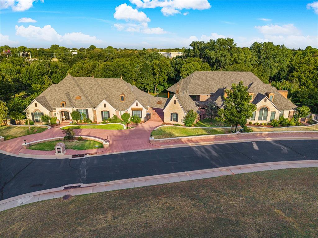 Step inside an estate unlike any other! Spanning over 9,500 sq ft on nearly 2, private, wooded acres, this extraordinary property is the ultimateblend of luxury, grand entertainment, and total seclusion. Positioned in the prestigious Rose Rock addition, backing to a greenbelt, this compoundfeatures 3 distinct structures: a main residence, an indoor pool house, and a separate guest suite. The main home boasts an executive study with agas log fireplace, a lavish primary suite, and a media room option for an extra bedroom suite. Host year-round in the climate-controlled indoor pool pavilion with a newly resurfaced pool, 3 bedrooms, full kitchen, pergola, and fire pit, offering great potential as a lucrative Airbnb. A separate 1-bed guest suite provides private accommodations for visitors. Major capital updates include a 2025 roof and updated HVAC with a 10-year transferable warranty. Located near Twin Hills & Lincoln golf courses and downtown OKC. Title work started at Stewart Title North OKC office. Broker's Open Happy Hour on Thursday, Sept. 3, from 4 to 6 pm. Schedule your tour today!