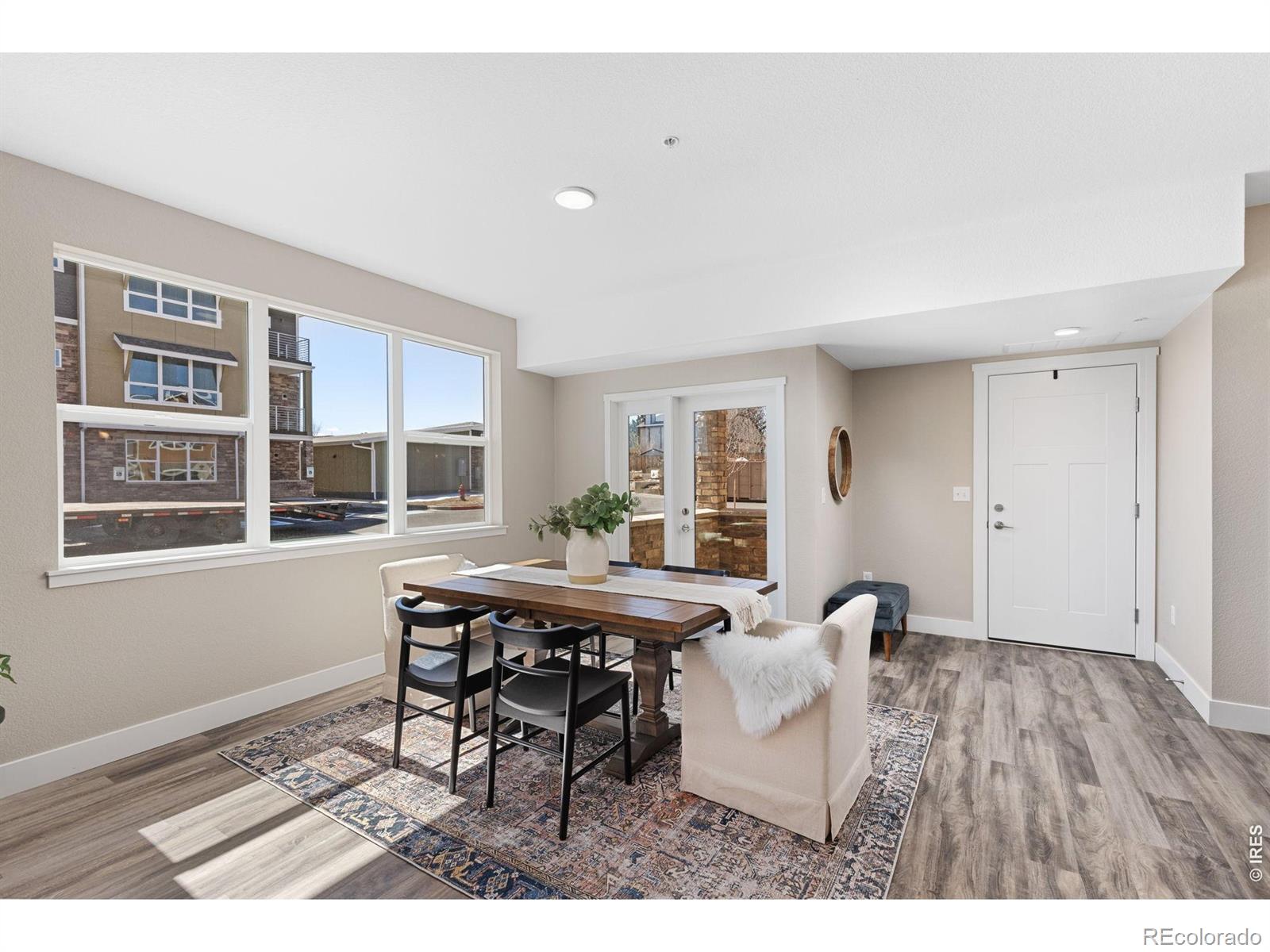 Discover one of Lafayette's newest premier communities, Cherrywood Condos, featuring the final phase of brand-new, never-lived-in residences completed in 2024. This bright 2-bedroom unit combines modern design with functional living, featuring an open-concept layout, oversized windows, and a private balcony that brings in natural light and fresh air. Several units already have renters in place, offering immediate income potential for investors or the flexibility to move in and enjoy brand-new construction firsthand. The kitchen is designed for everyday living and entertaining, with quartz countertops, a large island, and stainless steel appliances. High-grade laminate and luxury vinyl plank floors flow seamlessly through the living spaces, while an in-unit stackable washer and dryer add convenience. Select units include full appliance packages for a truly move-in ready experience. Residents enjoy community amenities including a fenced dog park and bocce ball court, providing opportunities for recreation and social connection. Low-maintenance living allows you to spend less time on upkeep and more time enjoying your home or managing your investment. Cherrywood Condos offer the perfect balance of style, comfort, and smart opportunity in a prime Lafayette location. ***Photos are digitally staged and of the model units.***