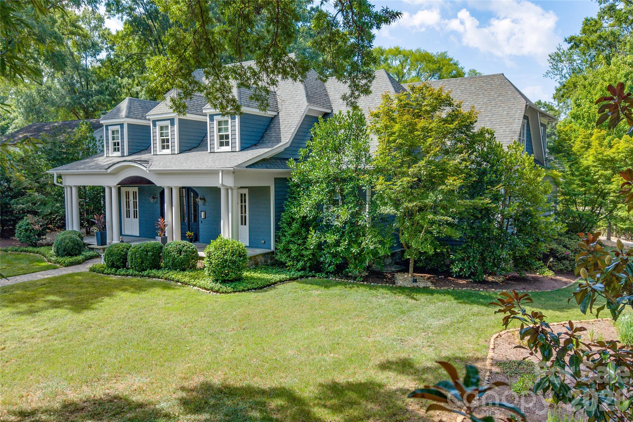 Welcome to a truly exceptional custom home in the heart of Old Foxcroft, one of Charlotte's most sought-after neighborhoods just minutes from SouthPark. Designed by local architect Christopher Phelps and custom built by Augusta Homes, renowned for its distinctive Lake Norman luxury residences - this is the only new home Augusta has built within the City of Charlotte! Behind its beautifully understated front exterior lies 5,284 sq ft of a thoughtfully designed home for both sophisticated entertaining and everyday family living. The heart of this home brings together a stunning Great Room with wood coffered ceiling, chef's kitchen, climate-controlled wine room, and scullery, while the 625 sq ft three-season porch with EZE-Breeze windows, fireplace and Wolf grill creates an extraordinary extension of the living space. A private main-level guest suite, family Resource Room and dedicated upstairs study, showcase a floor plan designed around how families actually live. Upstairs, every bedroom is ensuite, complemented by a spacious Primary Suite and Bonus Room with wet bar. Outside, enjoy a fenced putting green, an additional outdoor cooking area that was created by Charlotte Grill and includes an EVO grill, Yoder smoker, and a private backyard. Recent HVAC, furnaces, tankless water heater, whole-home generator and surge protection add peace of mind. A rare combination of architectural pedigree, exceptional livability and an established Charlotte location. Take one more moment looking at the pictures of the Three-Season Porch. Imagine the EZE-Breeze panels open on a mild fall evening, the fireplace going, dinner cooking outside, music playing and friends gathered around. That’s really what 2800 Wintergreen Drive is about. It combines the craftsmanship and architectural detail expected of a true custom luxury residence with something that can be much harder to find: A home thoughtfully designed for the way a family actually lives.