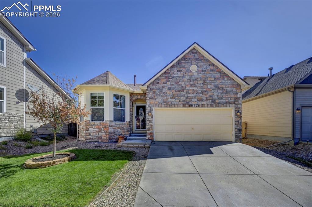 Welcome home! This charming and inviting home offers a comfortable space for those looking for simplicity and functionality. You'll first notice the beautifully landscaped front yard, stone accented exterior and oversized two car garage. Inside you will find the spacious front bedroom/office, beautiful low maintenance tile floors that begin at the front door and continue through the foyer and into the kitchen and living room which has tall, vaulted ceilings and several windows that bring in abundant natural light. The open kitchen has beautiful bright cabinets, stainless steel appliances and ample counter space for as little or as much cooking and entertaining as you'd like! Venture down the hall and check out the bright and clean full bathroom, laundry space and large primary bedroom nestled away from the rest of the home. Not to mention the artificial turf backyard space that will be a great place to relax, unwind, entertain and play! Very close access to groceries, dining, medical offices, and parks and recreation!