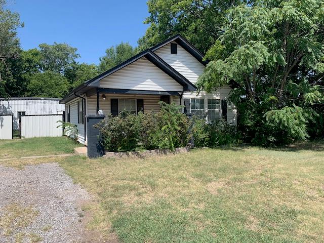 Investors!! Corner lot in old part of Moore with 900' shop in back and back access.  Selling AS  IS,  Needs TLC     Has hardwood floors and nice sized kitchen with breakfast bar.   Utility porch added on has 2 closets.     Whirlpool tub and skylight in bath.   Aluminum siding, Central heat and air.  Lots of potential.   Workshop has separate electric meter,  1/4 bath, great for home business, garage door opener and entrance off NE 1st.   Nice deck on north side in shade for morning coffee.  Has been a rental for a long time