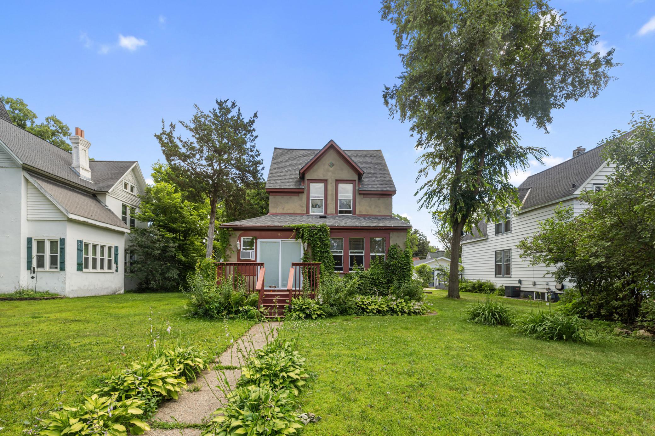 Charming 1910 Home with Classic Character & Bonus Garage Loft. Welcome to this beautifully preserved 3-bedroom, 1-bath home in the heart of Little Falls. From the wide trim and clawfoot tub in the updated bathroom to the timeless character throughout, this 1910-built gem offers warmth and functionality. Abundant windows fill the home with natural light throughout the day, with both morning and afternoon sun pouring into the living spaces. A flexible lower level bonus room space could serve as a 4th bedroom per city guidelines, and there's potential for a main-floor laundry and second bathroom. The Over-sized two-stall garage features a brand-new roof and a spacious 24x10 bonus loft - ideal for a rec room or studio with seasonal storage space - just waiting for your final touches. Enjoy the peaceful backyard retreat with a private patio, maintenance-free privacy fence, and mature landscaping complete with in-ground sprinklers, perennials, and flowering plants. Additional highlights include updated vinyl windows, ample storage, a newer furnace and water heater (less than 8 years old), central AC, and a sand point well. Located just steps from river access and within walking distance to the downtown district, dog park, fire department, and police station for added convenience and peace of mind. A well-cared-for home full of classic charm, flexible spaces, beautiful natural light, and a prime location!