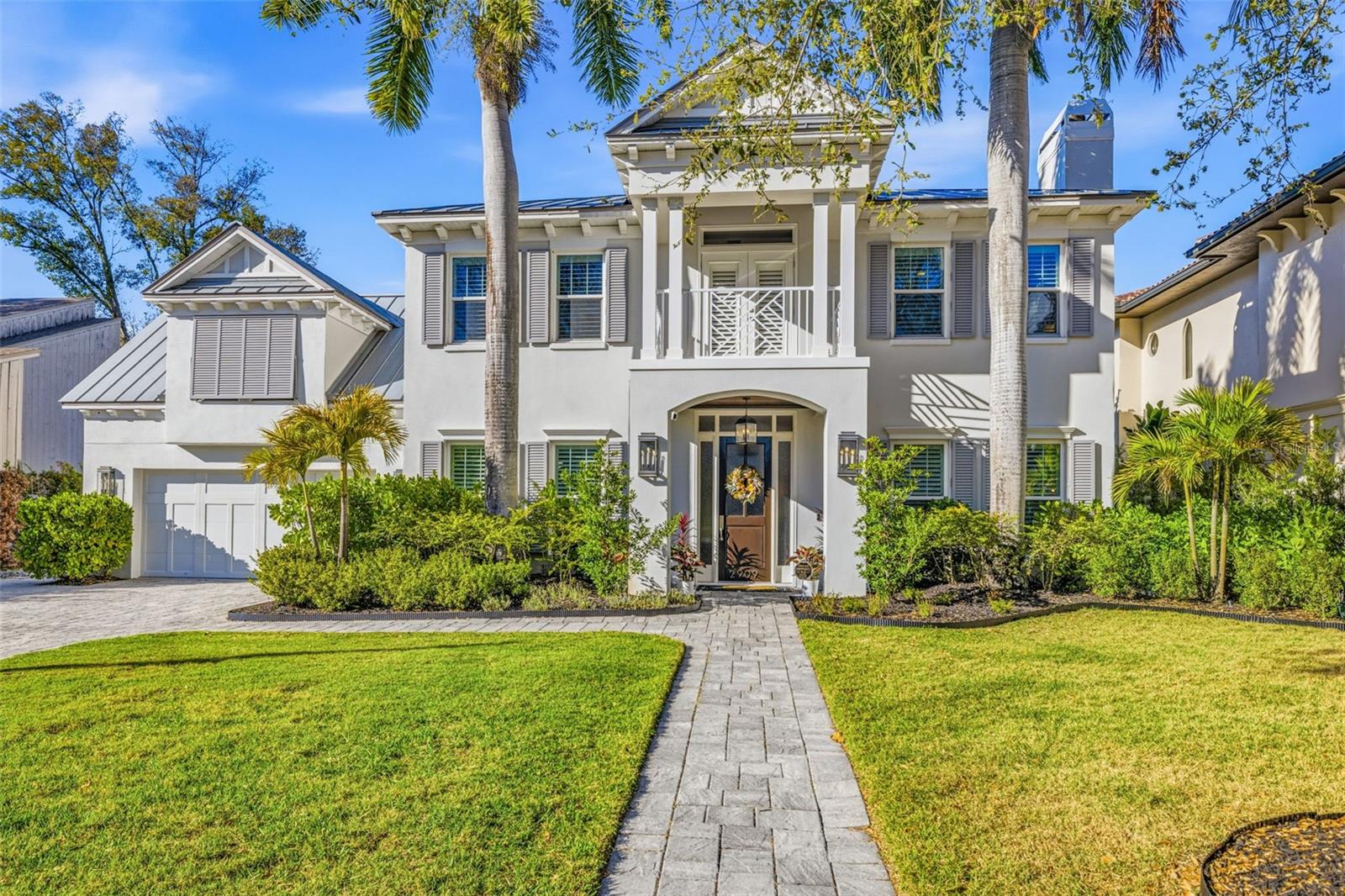 Under contract-accepting backup offers. Luxury living awaits in Bayshore Beautiful! Just 300 feet from the iconic views of Bayshore Boulevard, this 3,871-square-foot coastal contemporary pool home delivers refined design and exceptional craftsmanship throughout. Originally built by Hyde Park Builders and completely transformed in 2016 by Lloyd Craftsmen, the home underwent a full-scale renovation that gives it the look and feel of new construction while maintaining its established charm. Thoughtful upgrades include a metal roof, impact-rated windows, rich hardwood flooring throughout, and a resort-style backyard featuring a heated saltwater pool and spa, elegant travertine pavers, and a low-maintenance turf lawn—creating the ultimate private retreat. The open-concept first floor is ideal for entertaining, beginning with elegant formal living and dining areas that seamlessly transition into a spacious great room overlooking the kitchen and sophisticated wet bar. The chef’s kitchen is beautifully appointed with custom cabinetry, quartz countertops, a generous pantry, and a breakfast nook with serene pool views. Premium appliances include a gas Wolf range, Sub-Zero French door refrigerator, and Bosch dishwasher. Upstairs, the hardwood flooring continues into a versatile bonus room or optional fifth bedroom with abundant storage, along with four additional bedrooms—each offering its own en-suite bath. The luxurious primary suite features a spa-inspired bathroom, expansive walk-in closets, and a private balcony showcasing stunning views of Bayshore Boulevard and the waterfront. A dedicated office or reading nook within the primary suite creates the perfect work-from-home retreat. Adding further peace of mind, the home remained high and dry during prior storm seasons. Located within the highly sought-after Roosevelt, Coleman, and Plant school district and just minutes from South Tampa’s premier dining, shopping, and entertainment, this exceptional residence offers the very best of Bayshore living. Don’t miss the opportunity to make it yours.