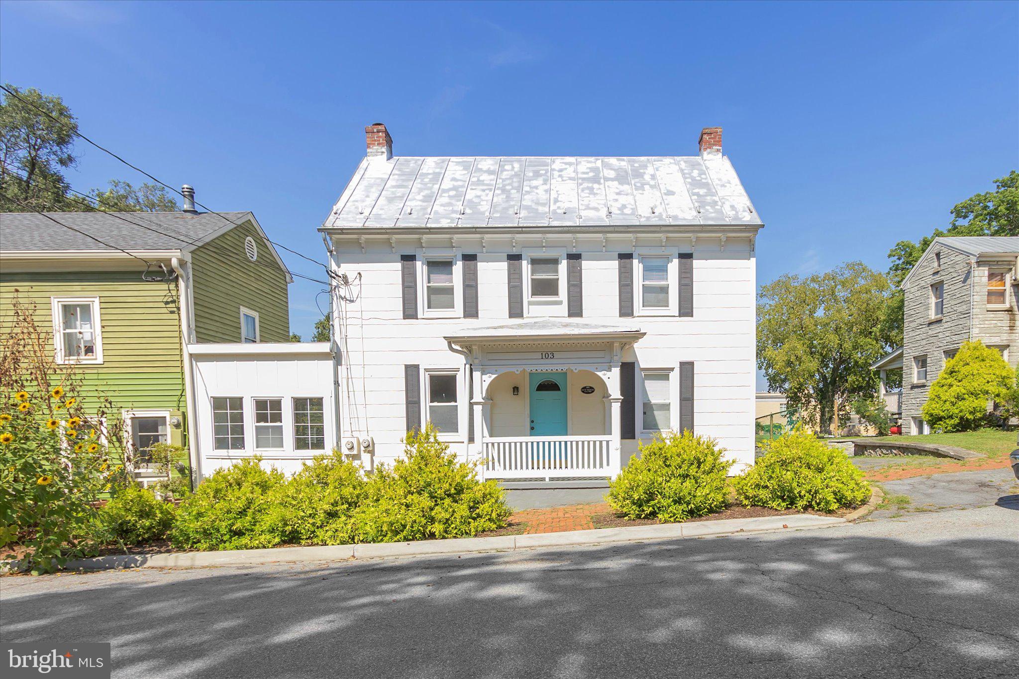 GREAT NEW PRICE! This charming residence in the desirable historic Shepherdstown community offers a perfect blend of comfort and style.  Deeds show a Hannah Tucker bought the lot in 1830, historians believe the existing home was built around 1890...post Civil War. See property history included in seller docs.  Step inside to discover a warm and inviting interior featuring traditional floor plans, cozy wood floors with some carpeted rooms,  and built-ins that enhance the home's character. The family room, overlooking the garden like backyard. It is conveniently located off the kitchen, is perfect for gatherings, while the gourmet kitchen boasts a spacious island and stainless steel appliances, including a self-cleaning oven and built-in microwave, dishwasher, and refrigerator, making meal prep a delight. The home's thoughtful remodel includes a dedicated laundry area on the main floor and, a cozy fireplace, ideal for those chilly evenings. Step down den/library/office and a step down family room are delightful surprises. Outside, enjoy extensive hardscaping, deck, and a brick patio, sidewalks and old stone foundations, perfect for entertaining or simply unwinding in your private rear yard.  An elevated walk area leads to a cute two story cottage ( 1 bedroom, 1 bath) which is perfect for an office, studio or, can be used as an efficiency rental unit. Located adjacent to Shepherd University, this cottage would be perfect for Shepherd employees or student, who want easy access to the University.  Situated on a 0.22-acre lot, this property offers convenient on-street parking...residential parking only which is strictly enforced. Two parking permits available for homeowners.  The Shepherdstown community is known for its friendly atmosphere, great restaurants, unique shopping and of course, the University, with nearby parks, Potomac River and recreational areas that encourage outdoor activities.  With easy access to public services and a vibrant town, this is not just a place to live, but a place to thrive. Experience the warmth and charm of Shepherdstown, where community spirit comes together beautifully. About 10 minutes from Marc trains; Rt. 340 and Maryland commuter routes including 81 and 70 as well as Virginia routes.