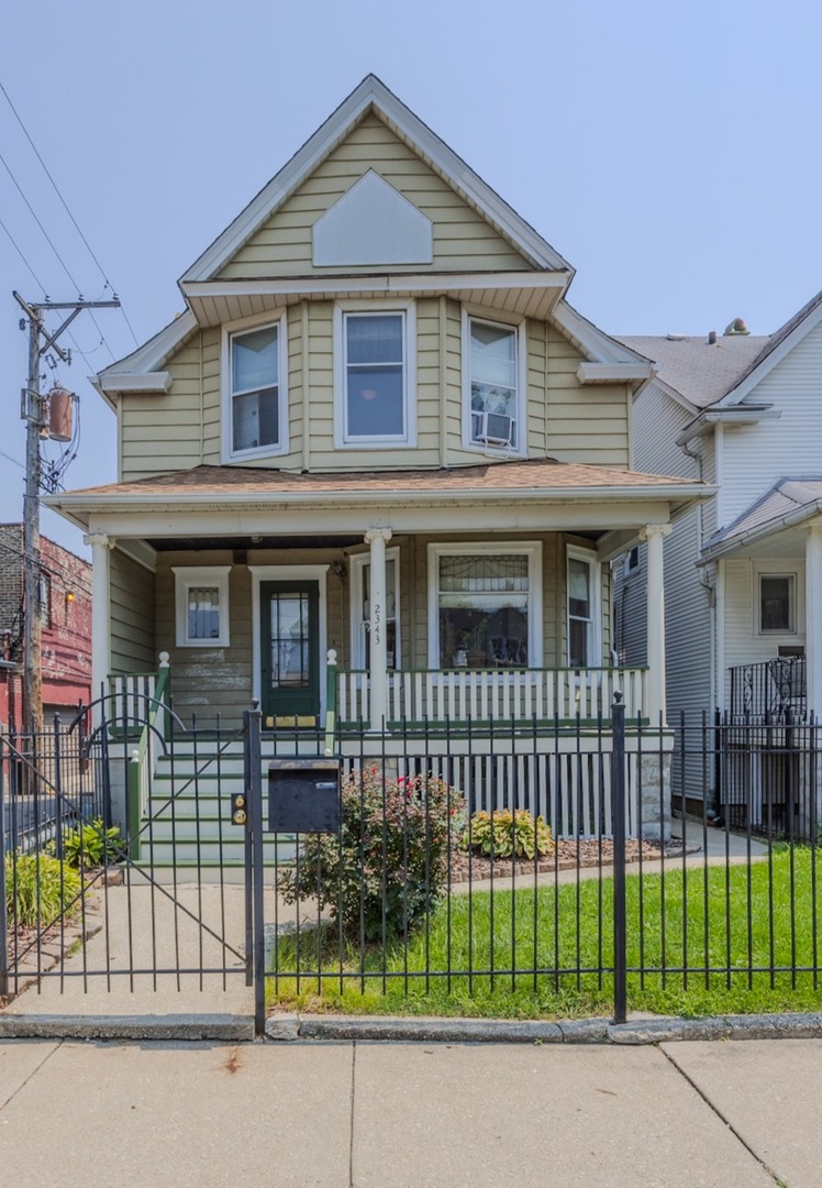 Logan Square Victorian Home - 3 Bedrooms, 2 full Baths with Hardwood Floors and lots of Natural Light throughout the home. The freshly painted Front Porch has space for a porch swing or Rocking Chairs to sit and enjoy the family. The livingroom / diningroom combo is connected to a newly updated kitchen which houses custom cabinetry, plenty of storage, and stainless-steel appliances. The kitchen French Doors open up to a spacious Mud Room with a roomy closet and ample lighting.  The entire 1st floor is equipped with the split heating/air conditioning units.  The full finished basement with a walk out exit also has a Gas Burning Fireplace, Laundry Room, Utility Toom and additional storage space.  The backyard has an attached 2nd level deck, freshly poured concrete walkway, manicured yard and a 2-car garage that has been retrofitted with the Juicebox Electric Vehicle Charging Station on its own circuit breaker.  The home and the garage are both equipped with the SUN POWER SOLAR panel system that efficiently and affordably powers electricity to the entire property.   Home Warranty included.  Property Being Sold As-Is.  Schedule your Showing Today!