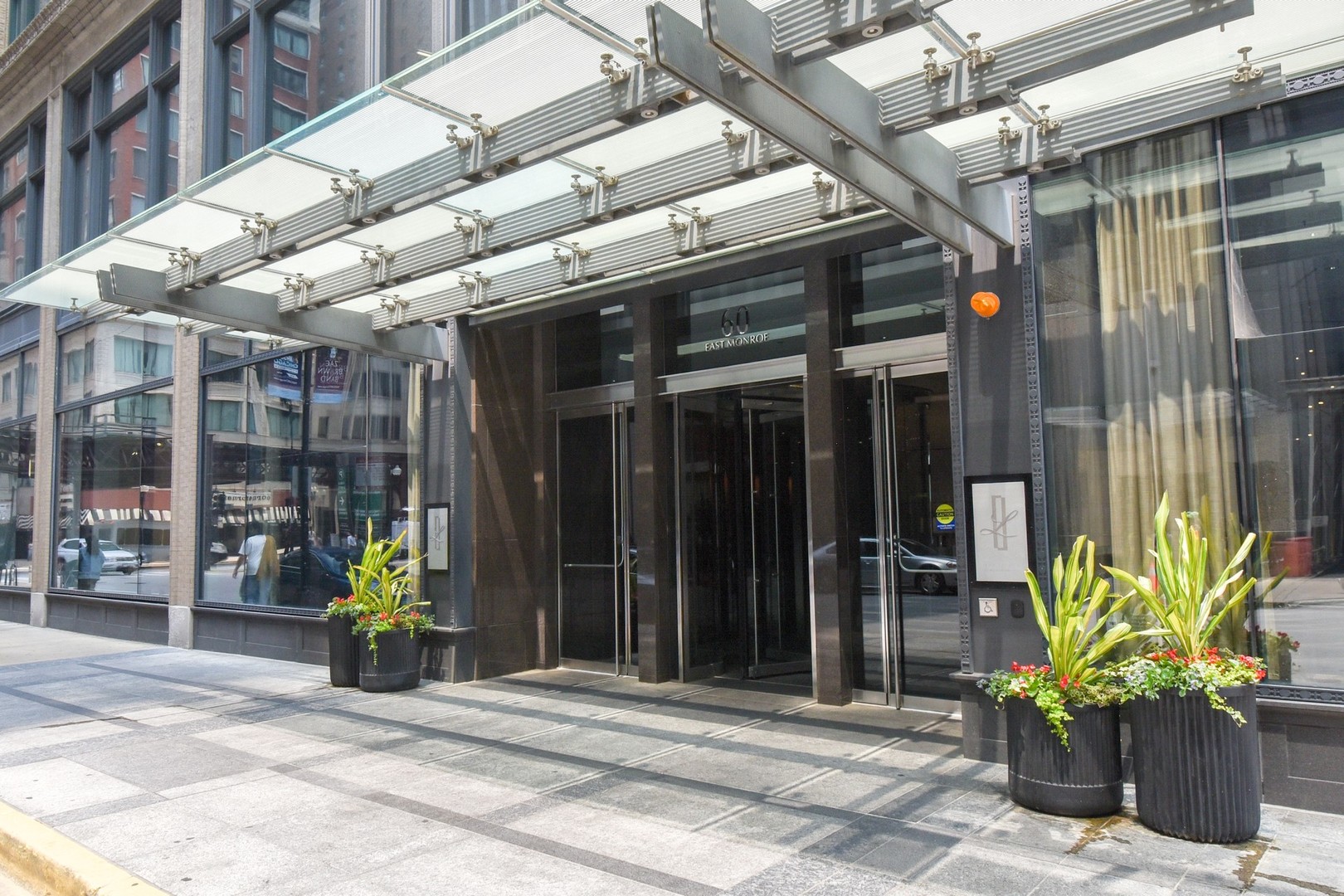 Be prepared to be wowed by this spacious, sun-drenched, luxurious 54th-floor condo with amazing lake views, in The Legacy at Millennium Park - a luxury condo building in the heart of everything Chicago offers. Enter the gorgeous lobby that's staffed 24/7, and take the high-speed elevator up to the 54th floor. At the unit, be welcomed into the inviting foyer featuring a convenient coat closet. Step into the main, open concept living area and take in the jaw-dropping south-facing views of Buckingham Fountain, Grant Park, Museum Campus, and the beautiful blue expanse of Lake Michigan - stunning views from every room in this home, including from your private balcony! Host your friends for a game night in the generous living area or cozy up with someone special for a quiet evening in. The adjoining spacious dining room can easily host your largest gatherings and features a beautiful accent tray ceiling and a stunning light fixture. Prepping your meals and snacks will be a delight in the generous chef's kitchen that features miles of granite countertops, quality, soft-close cabinetry, all stainless appliances, including a Sub-Zero refrigerator and separate wine fridge, and a deep, extra-large sink with a touchless faucet. When you're ready to retire, head down the hallway past your second bed and bathroom to the dreamy primary en suite! The amazing views continue with a full wall of windows in this spacious, sun-drenched retreat. The bedroom is bright and spacious, but also has fantastic motorised blackout blinds for when you want to sleep in! The massive primary bath was reconfigured for luxury - it boasts double vanities, a newer, large shower with rainshower head and a modern Toto Washlet seat. The expanded walk-in primary closet is spacious and organized, with space for all your apparel. The second bedroom is also spacious and boasts the same amazing view, along with its large closet. The oversized hallway full bath is new sliding glass door on the tub/shower enclosure, and leads to a huge bonus closet that's fully organized as well. A stacked, full-sized LG washer and dryer are stylishly tucked away off the hallway behind a door that's a beautiful rendering of Chicago. A garage parking spot and a separate storage locker included as well. This condo truly has it all - everything you need for stylish, comfortable, and convenient modern-day living and entertaining: quality updates; a reconfigured primary en-suite; convenient motorized Hunter-Douglas blinds throughout; thoughtful touches; and fantastic finishes; and a desirable South-facing view to take your breath away! But wait, there's more! The building boasts a fabulous pool with lakefront views, steam rooms, a private gym, two unique party rooms featuring their own kitchens and terraces, one with a fireplace (friendly neighbors often use these as coworking spaces as well!), plus a bonus outdoor terrace with a lush garden to enjoy outdoor green spaces and even a dog run for your furry family members! All this in the best location in town in the heart of everything Chicago has to offer-- museums, restaurants, shopping, coffee, bars, public transport, 290, and more! This is the one you've been waiting for--nothing to do but move in and enjoy summer in the city. Welcome home!