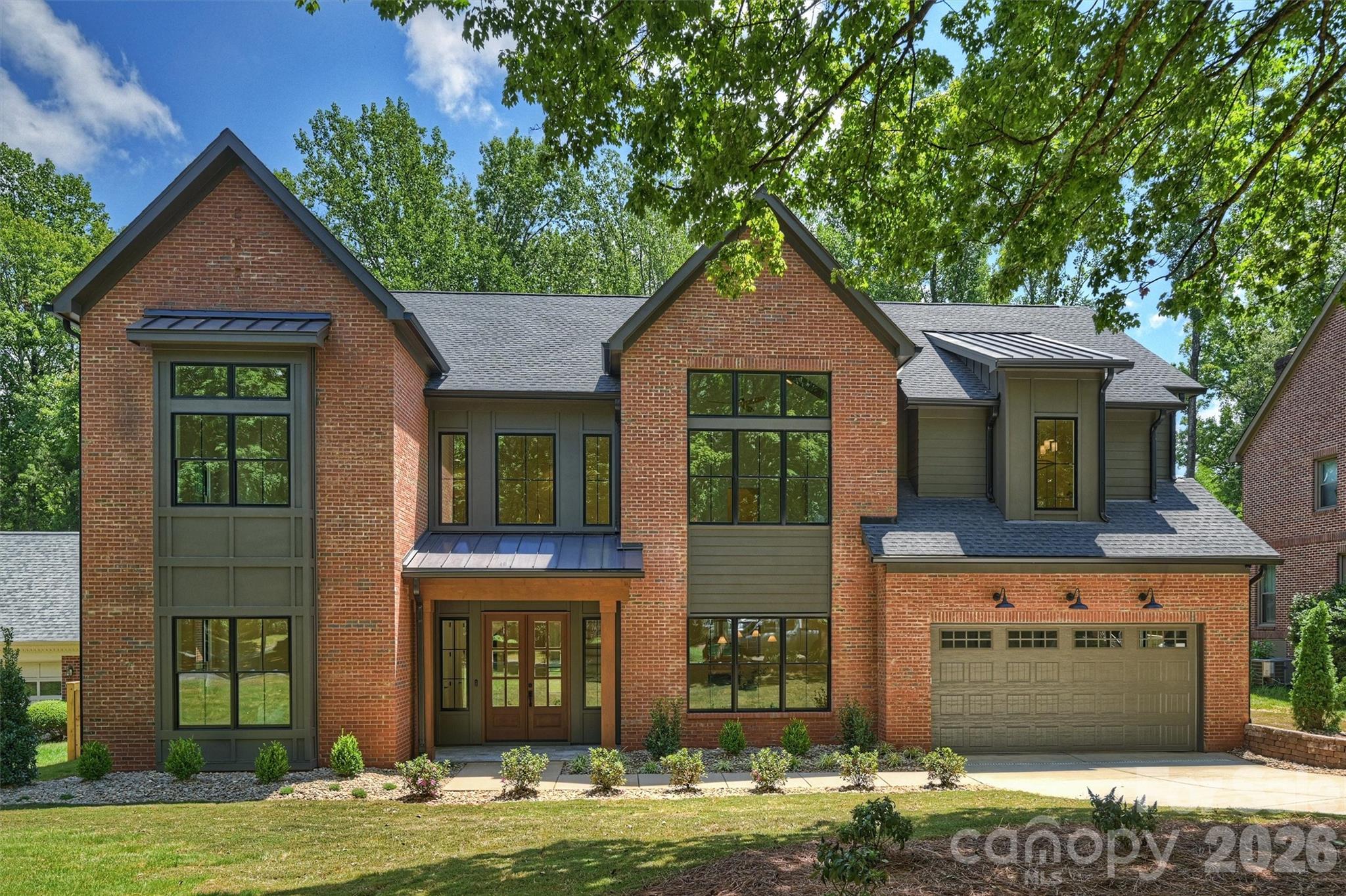 Set within the quiet, established charm of South Park, 2409 Brandermill offers a rare blend of quality, architectural elegance, and an entertainer’s yard for all to enjoy. This residence was taken down to its foundation and completely rebuilt from the ground up, resulting in a virtually brand-new, new construction home with structural integrity and uncompromised craftsmanship throughout. The expansive floor plan flows with pure intentionality, highlighted by designer touches and custom built-ins throughout. A grand foyer and soaring arched openings frame the main level, which features a formal dining space and a full main-floor guest suite. At the center of the home, the epicurean kitchen showcases a oversized focal island, custom wood-tone cabinetry, and professional-grade JennAir appliances—highlighted by a 48-inch gas range and panel ready fridge. Functional luxury is elevated by an adjoining scullery and walk-in pantry, keeping prep work hidden while the main space remains pristine. Hidden speakers allow sound and media to transition effortlessly from the kitchen into the grand living area.                                                                                                                The second level opens into a massive, loft-style secondary lounge which features dramatic vaulted ceilings and a 5.1 surround sound system. The primary suite serves as a private retreat, boasting soaring vaulted ceilings, a spa-inspired bath with a freestanding soaking tub and expansive signature shower, and a custom walk-in closet. Upstairs, you will also find three additional bedrooms and two full baths. Adding ultimate everyday convenience, the home is equipped with a dedicated laundry room on each floor. Outdoors, a covered and screened lanai provides an atmospheric setting to relax or host while overlooking the private, sprawling backyard.Built to the meticulous standards of QC Design & Build, every square foot reflects top-tier material selection, tech-forward efficiency, and elite craftsmanship. Situated in a prime location with rapid access to SouthPark and the best of Charlotte, 2409 Brandermill delivers the security and finish of brand-new luxury construction in a sought-after setting.