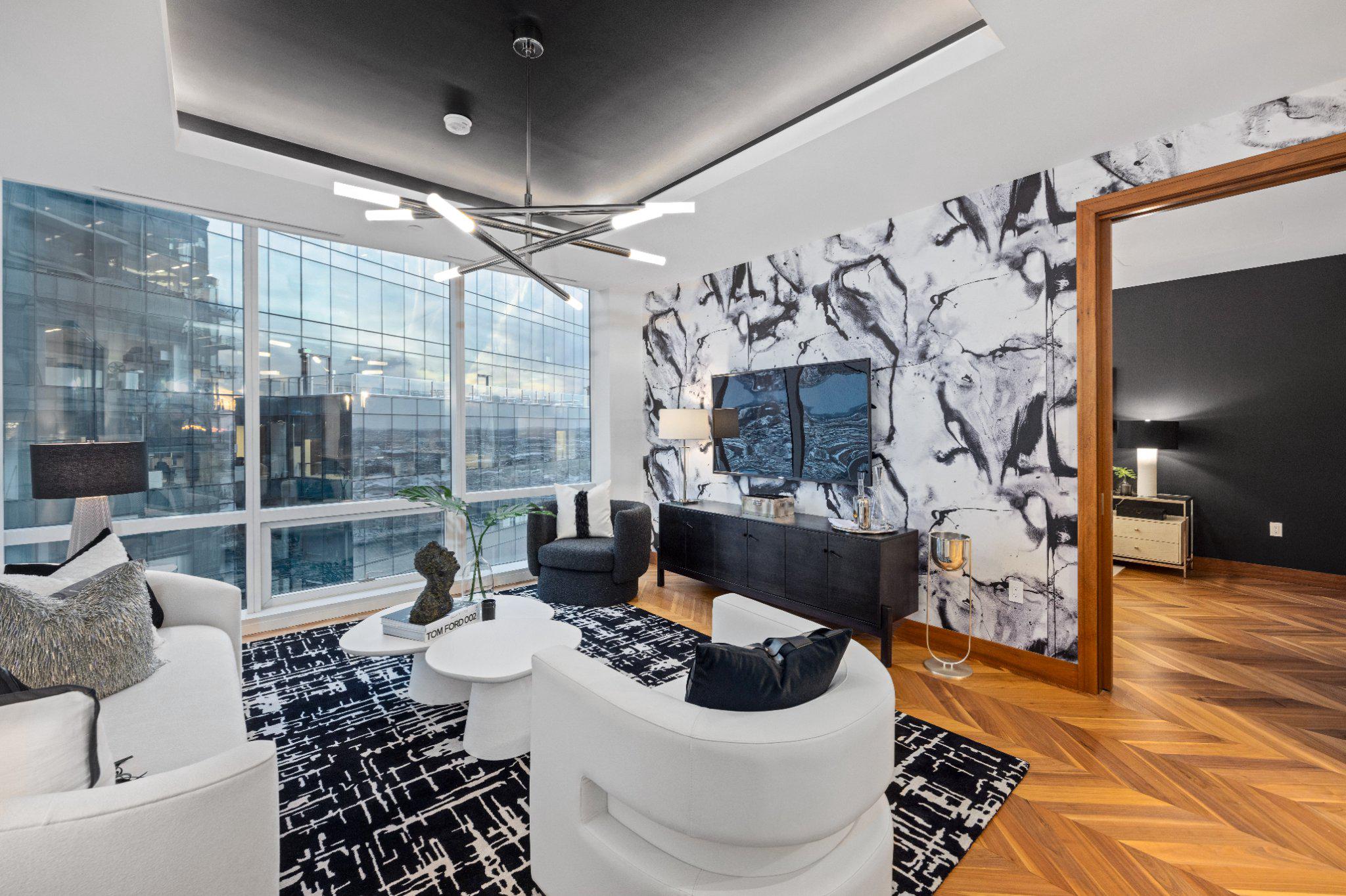 Discover luxury city living in this gorgeous home on the 23rd floor of the prestigious Four Seasons Private Residences. Located in Baltimore’s vibrant Harbor East neighborhood, this elegantly designed home features one-bedroom, one-and-a-half-baths, and a den, ideal for an office, work-out space or additional bedroom. A spacious open layout connects the kitchen, dining, and living areas - perfect for both relaxation and entertaining. Soaring 10-foot ceilings and floor-to-ceiling windows flood the space with natural light, highlighting beautiful details such as walnut herringbone wood floors, designer lighting, and a chef-caliber gourmet kitchen outfitted with Miele appliances. The primary suite features a generous walk-in closet and a luxurious marble en suite bath complete with a dual vanity, and soaking tub. Superb craftsmanship offers comfort and elegance. Residents enjoy full access to the Four Seasons Residences amenities, including a private indoor saltwater pool and spa, fitness center, four restaurants, outdoor deck and grilling area, and meeting rooms, ensuring a luxury living experience. In addition, residents can use any Four Seasons Hotel amenities, including the outdoor pool and bar, fitness center, and spa.  And of course, enjoy the city’s best waterfront dining,  shopping, cultural attractions, and recreational activities—right at your doorstep in Harbor East.
