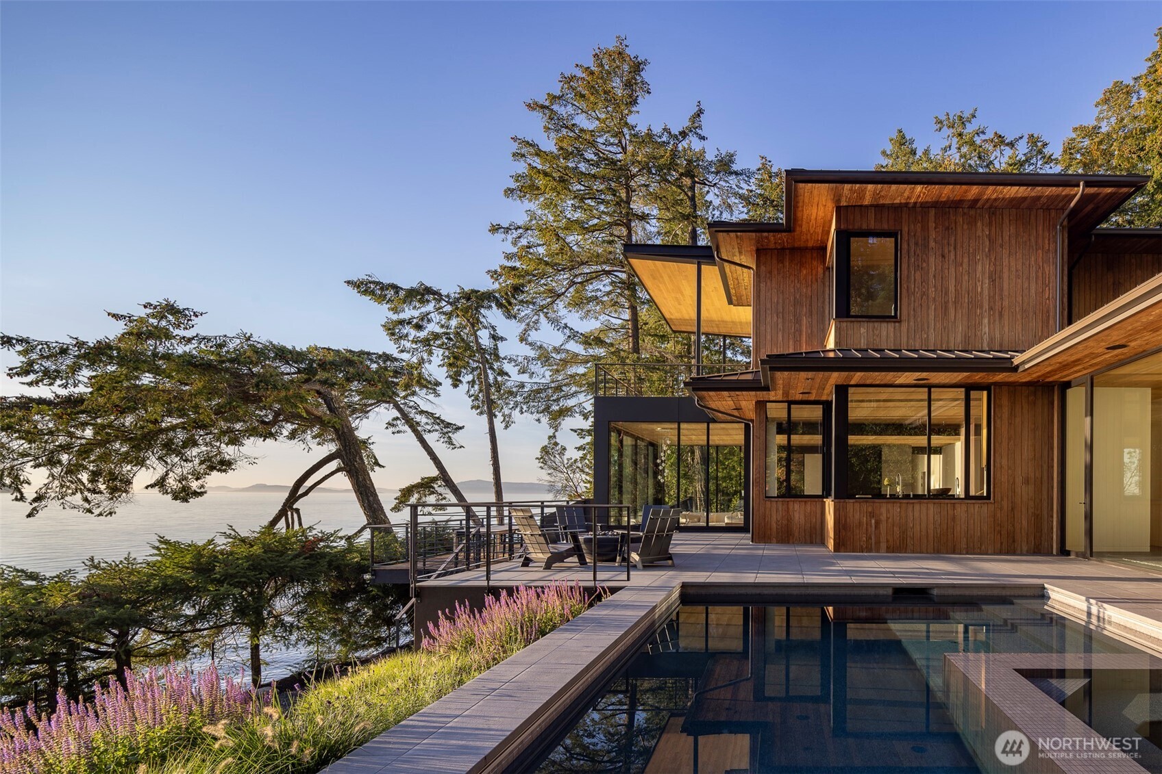 Unparalleled Deer Harbor waterfront estate w/ potential dock, 200’ private shoreline & breathtaking sunset views of outer islands and Salish Sea. Expertly crafted NW Contemporary main residence, guesthouse & studio blend striking design, privacy, natural beauty on 5+ acres. Possible dock, existing pier, boat lift, mooring buoy & detached 2-car garage complete this rare offering. Turn-key property w/ designer furnishings allowing buyers to step seamlessly into elevated island lifestyle. 5 bedrooms/5 baths, chef’s kitchen, stunning seaside pool & spa, expansive patios & grand outdoor dining area, the estate invites unforgettable generational gatherings. Forest trails, abundant wildlife, whales offshore complete this coastal sanctuary.