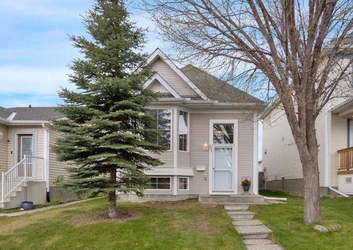 Don’t miss this fully developed 5 Bedroom Home offering over 2,000 sq ft of developed living space. From the moment you step inside, you’ll appreciate the bright open-concept design and spacious layout. The living room features hardwood flooring and large windows that fills the space with natural light. The kitchen offers an abundance of storage and counter space, including pantry and central island with breakfast bar, while the dining area provides patio door access to the outdoors — perfect for year-round BBQs. The main level includes 3 bedrooms with hardwood flooring and a full bathroom. The primary bedroom features a large wardrobe closet and direct access to the large deck, offering exceptional space and endless possibilities for outdoor living, entertaining, lounging and creating your own private retreat. The impressive fully developed basement expands the living space with a huge family room featuring an attractive two sided gas fireplace, built in shelving, plenty of room for your big screen T.V., oversized furniture and a games area. Two additional bedrooms and a full bathroom make this level perfect for teenagers, guests, or extended family. You’ll also appreciate the generous storage space, including a separate flex room - ideal for extra storage, a small hobby room, or workspace. You’ll appreciate the air conditioning during the hot summer days, Outside, the fully fenced, low maintenance backyard offers parking space, a garden area, and storage shed. Enjoy the convenience of being close to schools, parks, shopping, transit including the C-Train, and the Tuscany Residents Association with many fun programs and amenities to enjoy! An excellent opportunity - quick possession is available.