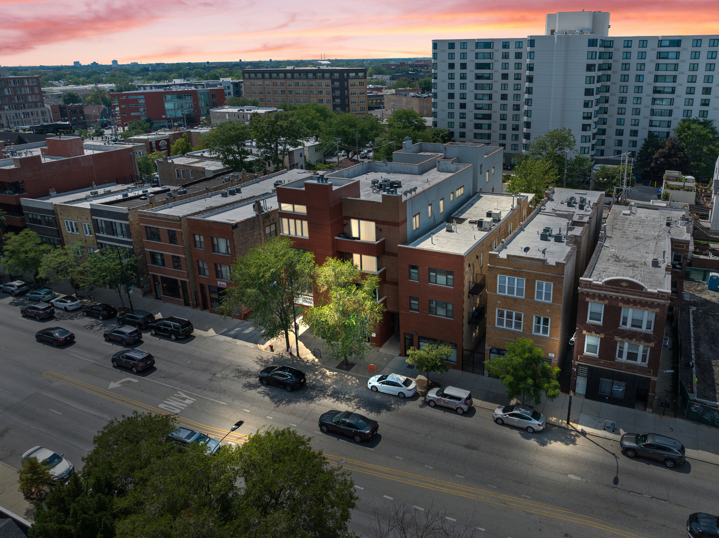 Immaculate Sun-Drenched 3BD/2BA Top-Floor Unit with Garage Parking & Private Balcony!   Welcome to this pristine, top-floor 3-bedroom, 2-bath home located in a boutique elevator building just steps from the Western Blue Line, the 606 Trail, Agora Market, parks, restaurants, and more.    This quiet, west-facing unit sits at the rear of the building with no shared walls, offering peace and privacy in a vibrant location. Inside, you'll find an expansive open-concept living and dining area perfect for entertaining, featuring a chef's kitchen with stainless steel appliances, granite countertops, slate backsplash, and a large island. The living space easily accommodates a full-size sectional and dining table, while sliding doors open to a spacious balcony-ideal for sunset views and al fresco dining.    The primary suite includes a walk-in closet and a beautifully updated marble bathroom with whirlpool tub, double vanity, and separate shower. Additional highlights include in-unit laundry (washer/dryer 2021), automatic window treatments (2025), updated windows (2022), new HVAC (2024), water heater (2023), and a brand new dishwasher (2025).    Garage parking is included in the price. Easy access to the 606 Trail, Blue Line, Midtown Athletic Club, Holstein Park, Margie's Ice Cream, restaurants, markets, and more.    Move right in and enjoy low-maintenance living in a fantastic elevator building!
