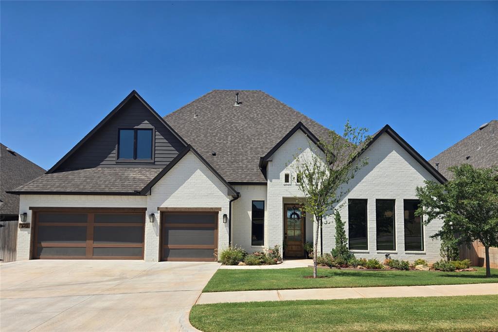 Stunning new listing in Pine Creek! It's beautiful! Open & airy floorplan, wood flooring, soft colors and great natural light. Features include a large living room with raised ceilings, fireplace, bookcases and ceiling fan. The adjoining kitchen is a cook's dream featuring loads of cabinetry, great countertop space, stainless appliances, island seating plus additional dining space and a walk-in pantry. The spacious master suite is on the lower level and easily accommodates king sized furniture. This suite also includes double vanities,  spacious shower plus a large 3-tiered walk-in closet. Also located on the main level is a nice office area and utility room. Upstairs features include an additional living room, 3 bedrooms and a full bathroom. The 4th bedroom/optional media room is large and is presently used as a fitness area. Exterior features include a nicely manicured yard, large covered patio and sprinkler system.