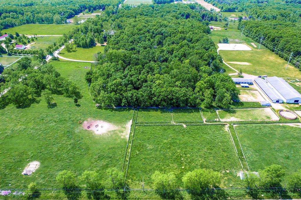 This property has amazing potential. Located in Ann Arbor (Scio Township), it offers the opportunity to build your dream home alongside equestrian amenities that support a full-time horse operation. The property includes over 34 acres with a large indoor arena, outdoor riding arena, more than 40 horse stalls, an apartment, observation room, wash rack, tack room, bridle paths, and more. A must see! WANT MORE INFO? Click the Virtual Tour link which has much more detailed information. Do not go to the property without an appointment. Current use is Agricultural,Farm,Other.