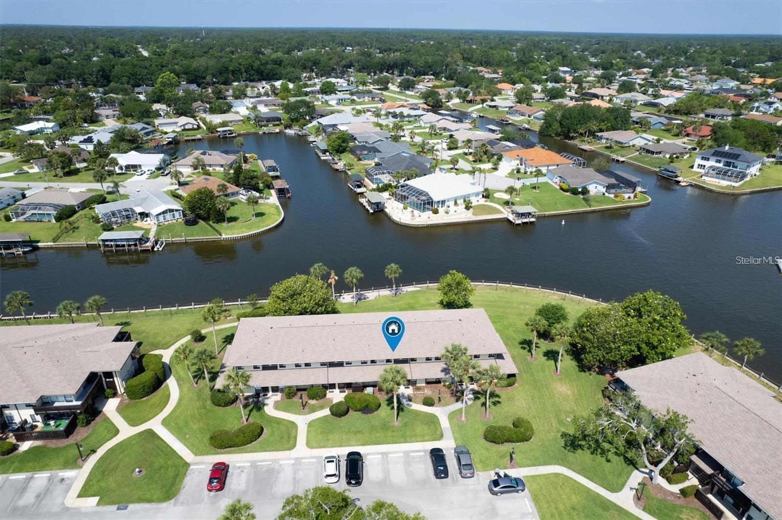 Enjoy some of the best waterfront views in the community from this beautifully updated townhome-style condo on the saltwater canal. This move-in-ready home has been thoughtfully updated in recent years and features a gorgeous kitchen with tile backsplash and stainless steel appliances, updated bathrooms, modern lighting and fixtures, newer tile flooring downstairs, wood-look laminate flooring upstairs, and washer/dryer. The spacious floor plan offers comfortable living with the kitchen, great room, and half bath located on the main level, while both bedrooms and the full bathroom are privately situated upstairs. Large windows and sliding glass doors fill the home with natural light, and you'll enjoy both a covered patio and a private upstairs balcony to take in the peaceful waterfront setting. Residents enjoy resort-style amenities including a community clubhouse and swimming pool. Low-maintenance living is made easy with WATER, CABLE, LANDSCAPING, and GARBAGE service all INCLUDED in the rent. Available now!