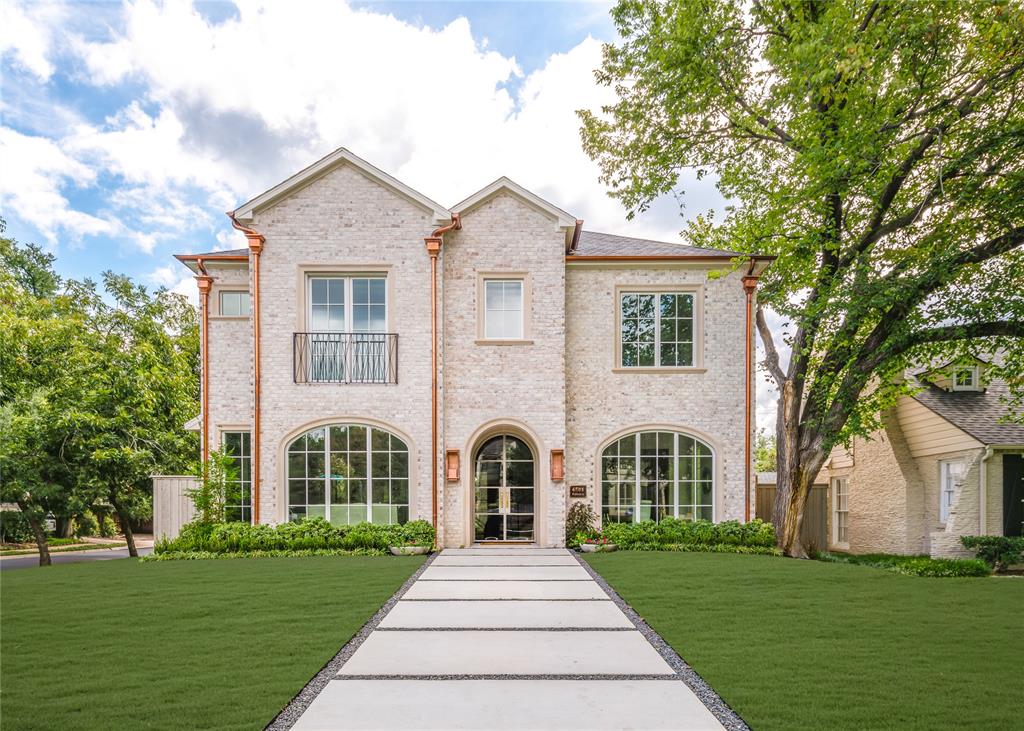 This elegant 5,659 sq ft new construction by Prous Homes offers timeless design and exceptional craftsmanship in the heart of Highland Park. Ideally located just a short walk from Bradfield Elementary, Highland Park Village, and the Dallas Country Club, the home features 5 bedrooms, all ensuite, along with 6 full baths and one half bath.
Inside, the chef’s kitchen is outfitted with a 48” Sub-Zero refrigerator and freezer, Wolf appliances, Taj Mahal Quartzite countertops, and a spacious walk-in pantry. A stylish bar and lounge area with a Sub-Zero wine fridge and ice maker connects the study or formal living space to the warm and inviting family room, which showcases a hand-carved limestone fireplace and wood beam accents. The living room features a striking black marble fireplace and grasscloth wall covering, adding texture and elegance.
The main level also includes a mudroom off the garage and an office tucked just off the kitchen. Outdoor living is seamless with a patio and fireplace for year-round enjoyment. White Oak floors run throughout the home, complemented by curated lighting and high-end finishes.
The second floor offers four bedrooms, including a luxurious primary suite with an oversized walk-in closet, a large game room, and a generous laundry room. The fifth bedroom is located on the third floor, offering flexibility for guests, a home office, or gym.
This beautifully designed home blends sophistication and comfort in one of Dallas’s most desirable neighborhoods.