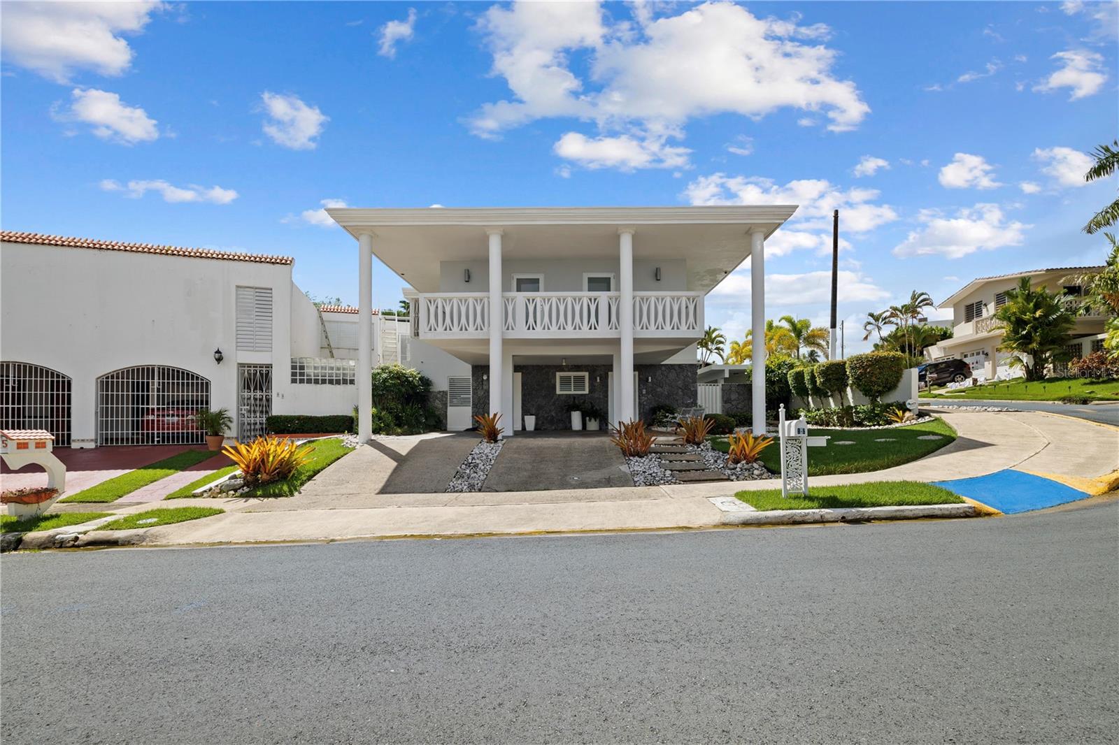 Experience refined living in this elegant two-story home located within the private gated community of El Remanso in San Juan. Set on a 875m2 lot, the property offers five bedrooms and 3.5 bathrooms, blending comfort, privacy, and timeless character. The interior features bright open spaces, a functional kitchen ideal for gatherings, and a smooth transition to outdoor living areas that invite relaxation and entertainment. The outdoor area is designed for enjoyment and leisure, featuring a swimming pool, terrace, landscaped garden, and a private basketball court. A separate service room with full bathroom provides versatility for live-in staff, chefs, or guest accommodations, enhancing the property’s convenience and value. Built with solid concrete construction and carefully maintained, the home reflects lasting quality and thoughtful design. El Remanso offers security, tranquility, and proximity to major roads, schools, and shopping centers, making it a rare opportunity to own a distinguished residence in one of San Juan’s most desirable neighborhoods. CRIM: $3,413 annually.