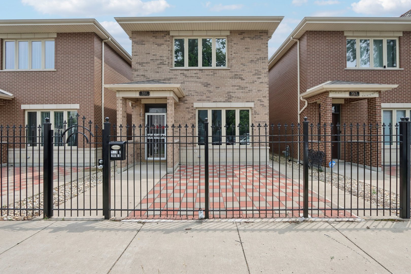Spacious and well-maintained all-brick 4-bedroom, 3-bath home located on a quiet block in Brighton Park. Built in 2020, this two-story residence offers over 2,500 square feet of living space with hardwood floors throughout, a main-floor bedroom and full bath, and an open-concept living, dining, and kitchen area-perfect for entertaining. The large kitchen features an island and full appliance package, with generous room for dining.    Upstairs you'll find a massive primary suite with space for a sitting area or home office, along with two additional bedrooms and a third full bathroom. Updates completed in 2024 include a new storm door at the front entry, an awning over the rear sliding door, and newly paved concrete brick patios in both the front and backyard, providing low-maintenance outdoor living.    A detached two-car garage includes a convenient rear overhead door for added flexibility during outdoor gatherings. Enjoy in-unit laundry with sink, and easy access to local parks, public transit, and neighborhood amenities.    This move-in-ready home is ideal for both daily living and hosting-schedule your showing today.