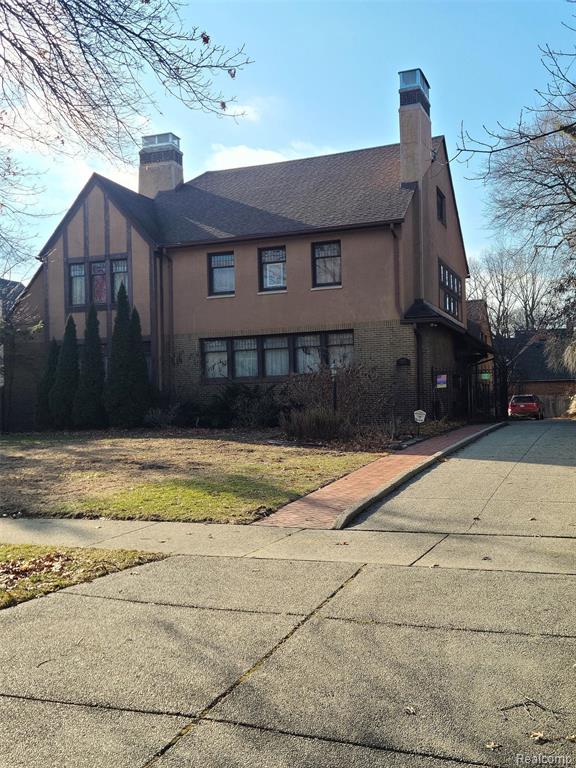 Amazing Historic Indian Village house designed by renowned Architect Leonard B. Willeke for the Hudson-Webber family. This stunning 6-7 BR Home has natural wood throughout, both floors and paneling. The Lg foyer has a Pewabic floor, as does the sunroom. Living room has one of the most amazing Pewabic fireplaces in Indian Village, plus built-ins, Pocket Doors leading to the sun room which also has a Pewabic fireplace. Lg dining room w/plaster crown moldings, leaded glass doors and built-ins, original chandelier and wall sconces. Substantial butler pantry w/ample storage, more built-ins and Chrysler-Koppen fridge. Lg kitchen waiting for new owners to decide how they would like to make it their own. Gracious staircase leads to the 2nd Floor which has a large primary bedroom w/ Pewabic fireplace and en suite bath. Two more lg bedrooms w/bath. 3rd Floor has 2 more lg bedrooms and full bath. Attached 2-car garage w/servants quarters above, w/1-2 Bedrooms and full bath. There are many original features, light fixtures, leaded glass windows and doors. Indoor storms on first floor. Updated breaker box, newer boiler (2016). Lg basement laundry room. Newer exposed aggregate driveway, newer backyard fence and wrought-iron driveway gate.This amazing arts-and-craft style house is one of a kind. Work is needed in some areas and this is reflected in the price. Home Warranty included. This house is shown by Appt. Only, POF/Pre-App needed Prior to all Showings. Please call agent if you have any questions. House is being sold as is. BATVAI