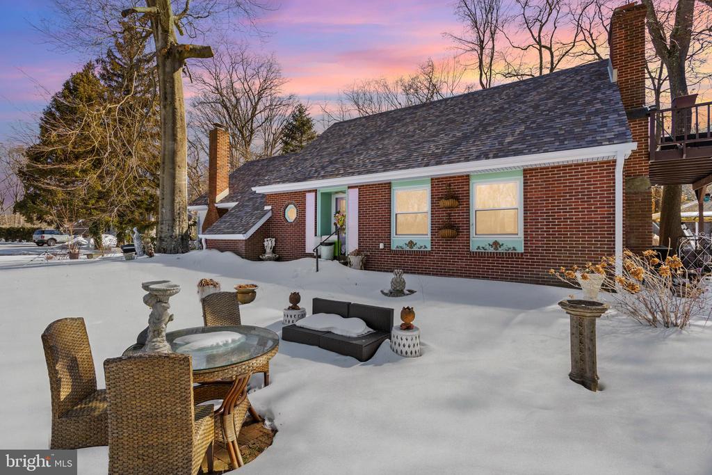 Live on the Lake!  This lovely three bedroom home sits right on Sylvan Lake!  Enjoy fishing and boating from your stunning , peaceful lakefront location.  Many recent updates include a new main bath, a  beautiful updated kitchen with quartzite counters, a copper sink, ceramic backsplash and Cafe Series appliances and a new roof in 2024.  . This all brick home boasts 2 fireplaces, a formal dining room,  hardwood floors and more.   Enjoy your mornings from the second floor Primary  Suite deck overlooking the lake.  A first floor laundry and many new windows complete the picture.