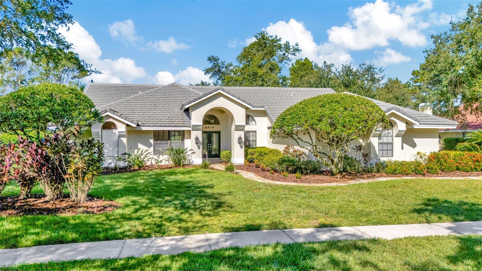 Nestled behind the gates of the coveted Hunter’s Green Golf & Country Club, this thoughtfully updated Bimini model by Rutenberg offers refined Florida living with panoramic fairway views of Hole #2—right from your own backyard oasis.  This beautifully updated Bimini floor plan by Rutenberg offers the perfect blend of space, style, and setting. With 4 bedrooms, 3.5 baths, a private den, and 3,374 sq ft of living area, this spacious, open-concept home is ideally situated on a premium golf course lot, providing elegant views of the fairway and green from your private backyard oasis.
The home features travertine flooring throughout, a side-entry oversized 3-car garage, and a freshly painted exterior. The kitchen is equipped with all-new stainless steel appliances, and the fireplace is pre-plumbed for natural gas, ready for your finishing touch. A new front-load washer and dryer are also included.
Additional improvements include a new Carrier HVAC system with replaced air handler and compressor, a dedicated 30-gallon hot water heater for the primary suite, and a secondary 5-year-old water heater for the rest of the home. The pool area features a new cartridge filter system, and the enclosure was rescreened in 2022 with material rated for up to 130 mph winds. Outdoors, you'll find custom-built cabinetry with cedar shelving, super gutters surrounding the pool area, and two separate water meters—one for the home and one for irrigation. For electric vehicle owners, the garage features a 240-volt EV hookup (NEMA 14-50).
This exceptional home is conveniently located near top-rated schools, shopping, dining, medical facilities, and major interstates, offering easy access to everything the Tampa Bay area has to offer. Thoughtful upgrades, timeless finishes, and one of the best golf course locations in the community make this home a must-see. Don’t miss the opportunity to enjoy luxury living in one of Tampa’s most sought-after neighborhoods.