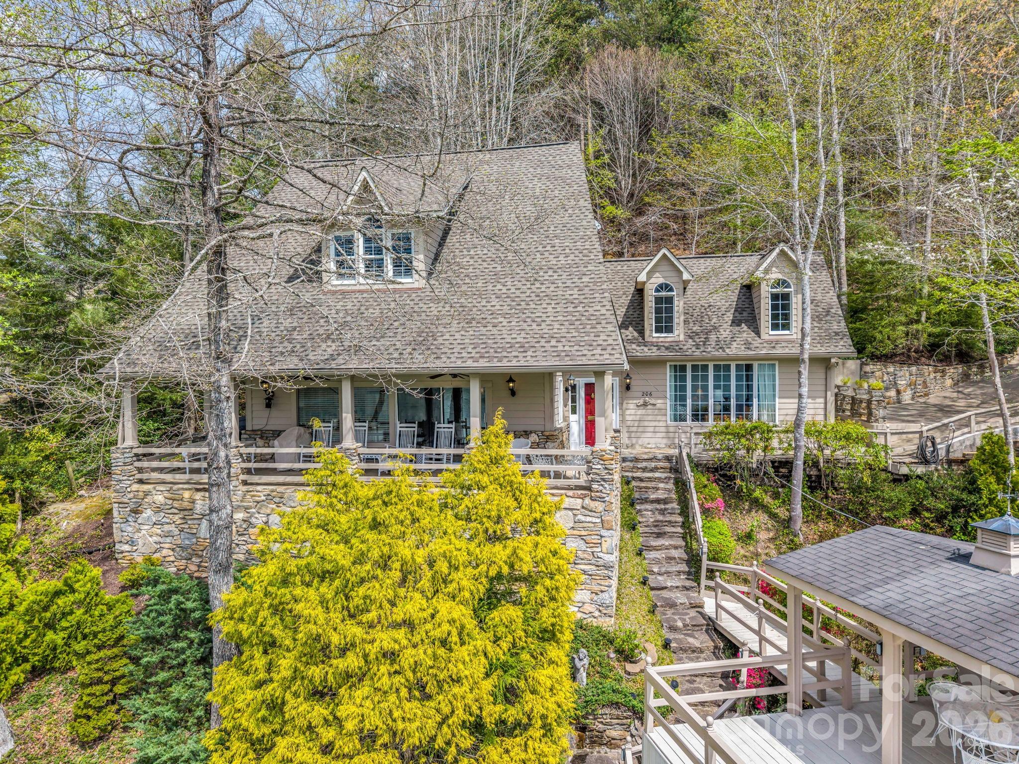 Location, location, location! Beautiful lakefront home, located at the end of Lakeridge Road brings a private setting that is seldom found on Lake Lure. This 4 bedroom 2 bath home comes fully furnished and is move in ready.Inside you will find a kitchen that is only steps away from a spacious covered stone porch that overlooks the lake and is ideal for entertaining. The main floor features two bedrooms, one bath, kitchen, dining, laundry and an inviting living room with a vaulted ceiling and a gas log fireplace. Upstairs you will find the primary bedroom, bathroom and a guest bedroom. The roof of the boathouse features an expansive deck ideal for sunbathing and delivers breath taking views of the lake and the mountains. The private dock below is perfect for boating, swimming and fishing. Just 13 steps to the top of the boat house and 11 more to the bottom. Boat house has a boat lift.This property is located a short distance to a number of restaurants, shopping, Apple Valley Golf Course and Bald Mountain Golf Course .Don't miss out on this beautiful lake home priced below the recent appraised value.Whether you are looking for a private home or a vacation rental property, this is a home that you must see!