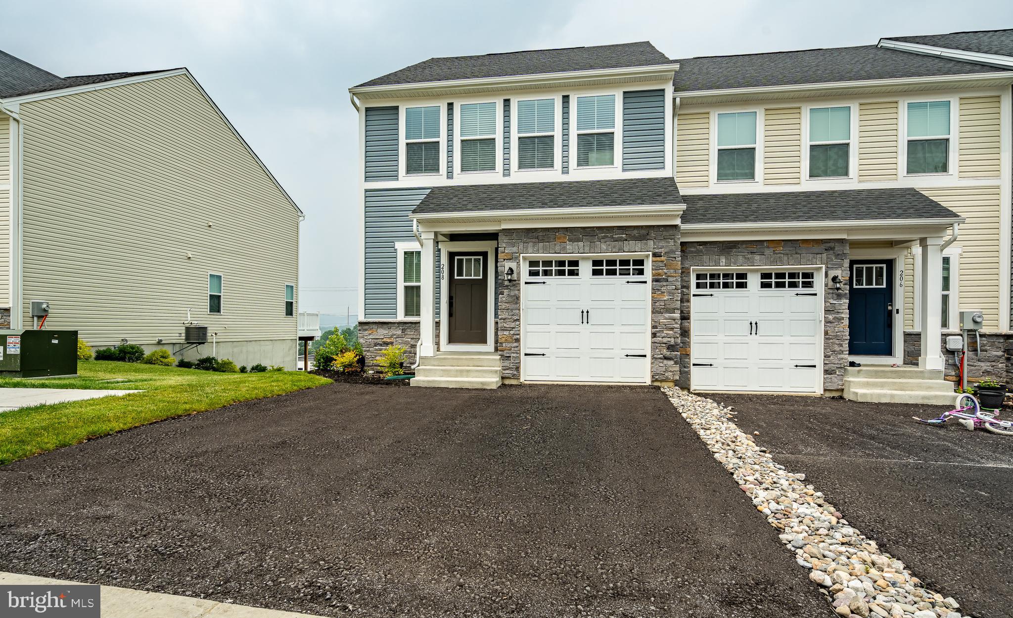 Buyers will love how this nearly new 2023 end‑unit townhome at 208 Chase Dr combines modern style with everyday comfort in one of the most desirable areas of Downingtown. From the moment you walk in, the bright open layout feels welcoming, with sunlight streaming through the extra end‑unit windows and highlighting the beautiful hardwood floors. The gourmet kitchen becomes the natural gathering place, offering plenty of space for cooking, hosting, or simply enjoying a quiet morning coffee. One of the standout features is the fully finished walkout basement, which feels like an extension of the main living space—perfect for movie nights, a home gym, a playroom, or a private guest area, with direct access to the backyard for easy indoor‑outdoor living. Upstairs, the spacious bedrooms provide comfort and privacy, especially the serene primary suite with its walk‑in closet and modern bath. The neighborhood is peaceful and friendly, with top‑rated Downingtown schools, parks, shopping, and major commuter routes all just minutes away. This home offers the perfect blend of convenience, style, and low‑maintenance living—an ideal choice for anyone looking for a move‑in‑ready home with thoughtful upgrades and a warm, inviting feel.