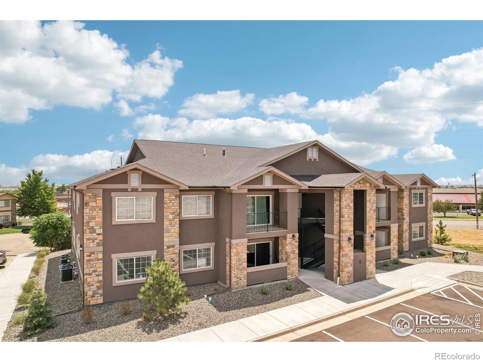 Seller is offering a $12,000 CONCESSION that the Buyer can use towards CLOSING COSTS or a RATE BUYDOWN. Elevate your lifestyle in this newly built top-floor condo, where breathtaking panoramic views of Denver's skyline set the perfect backdrop for urban living. This spacious 3-bed, 2-bath condo harmoniously blends comfort and elegance, offering a welcoming atmosphere that's perfect for both relaxation and entertaining. Inside, the open-concept layout impresses with vaulted ceilings and wood laminate flooring that not only elevates the interior but also offers the practicality of low-maintenance living. The heart of the living area is a charming gas fireplace, creating a cozy and inviting space for gatherings or peaceful nights in. The kitchen is a centerpiece, designed to be both functional and beautiful. With its marble countertops and modern stainless steel appliances, this space is well-equipped for any culinary endeavor, whether you're crafting everyday meals or hosting special occasions. The primary suite is a private retreat, offering an ensuite bathroom and a walk-in closet for all your wardrobe essentials. Soft, plush carpeting in the bedrooms adds an extra layer of comfort, making these spaces feel even more inviting. Step outside onto the covered patio, the perfect space for enjoying a morning coffee or dining alfresco, with the added convenience of a storage closet to keep your essentials organized. Parking is hassle-free, ensuring that your comings and goings are smooth and easy. Situated in a prime location, this condo provides excellent access to Denver, DIA, and the surrounding Metro area. With a short distance to dining, shopping, entertainment, and transportation options, you'll have everything you need right at your doorstep. Rentals with a minimum duration of 30 days are permitted. There are multiple new units available in the building. See MLS #1036825 for a ground floor model. For all scheduled open houses, please visit the model unit #71.