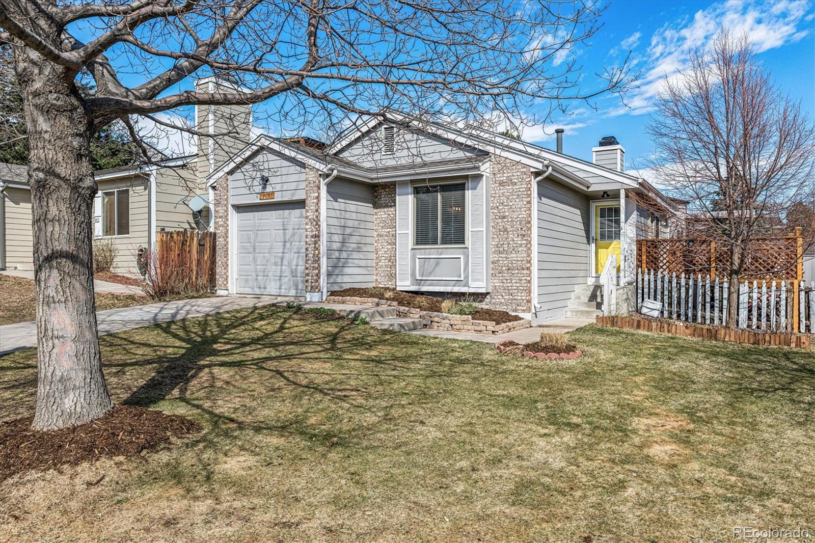 PROFESSIONAL PHOTOS COMING! This beautifully updated, south-facing home blends modern upgrades with comfortable living, all set along a quiet, tree-lined street. Nearly EVERY inch has been thoughtfully refreshed, creating a move-in-ready home that truly shines. Step inside to a welcoming entry that opens to a bright and spacious great room featuring soaring vaulted ceilings, a charming wood-burning fireplace with custom mantle, and a new ceiling fan. Newer luxury vinyl tile flows seamlessly throughout the home, guiding you into the beautifully remodeled kitchen, the true heart of the home with under cabinet lighting, stainless appliances, granite countertops, sustainable ceramic tile floor, chic subway backsplash, & modern lighting. The sun-filled primary suite offers a fully remodeled bathroom & an exceptional walk-in closet with abundant storage. A second bedroom provides flexibility for guests, a home office, fitness space, or children’s room, & enjoys direct access to the second completely remodeled full bathroom. Fresh paint on walls, ceilings, baseboards, and exterior siding (2023) adds to the home’s crisp, updated feel. Step outside to the oversized redwood deck, perfect for dining al fresco or relaxing under the Colorado sky. The expansive private lot features mature landscaping & ample space for play and entertaining, along with two a 55 sq ft tool shed and a well-built 100 sq ft workshop with loft, wraparound shelving, and a window that fills the space with natural light; ideal for hobbies, projects, or additional storage. Both sheds were painted to match the home, and both sheds and home received new roofs in 2023. Lovingly maintained and thoughtfully improved, the home also includes a new front door and storm door, new blinds throughout, siding replacement, and in 2020 major system updates include the furnace, hot water heater, washer, dryer and dishwasher.  A stylish, comfortable home offering exceptional value, this is one you won’t want to miss!