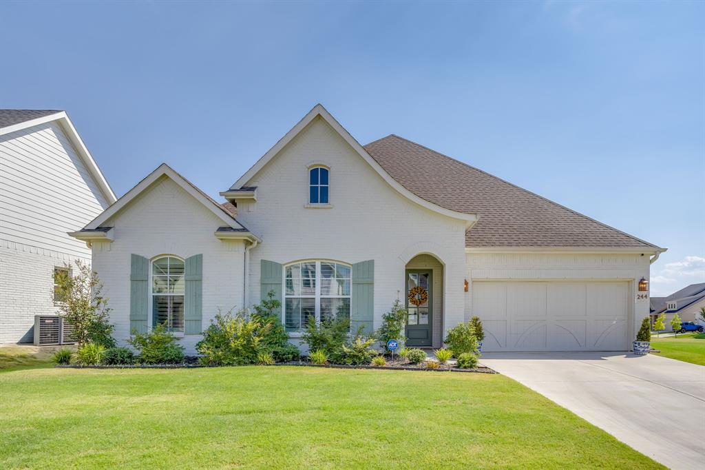 Every inch of this beautifully upgraded home is filled with character, charm, and thoughtful details in one of Aledo’s most sought after communities. Offering 4 bedrooms, 3 full bathrooms, and a versatile upstairs bonus room, this home adapts to your lifestyle; whether you need a 5th bedroom, guest suite, game room, office, play room or workout space. Nestled on an oversized corner lot, this property is designed for both relaxation and entertaining. Unwind under the gabled cedar patio cover while taking in breathtaking Parker County sunsets and with plenty of space to add a pool; the possibilities are endless with this lot. Inside, you’ll immediately notice the designer touches that set this home apart—from the custom shutters and shades that add warmth and elegance to the boldly painted blue kitchen island that serves as the heart of the home. The upgraded light fixtures create a stylish ambiance throughout. The chef’s kitchen is a true standout, featuring quartz countertops, stainless steel appliances, a gas cooktop, built-in double ovens, and abundant cabinet storage. The primary suite is thoughtfully designed with an oversized drop-in tub, frameless glass shower, and custom finishes. Located in the highly desirable Parks of Aledo, this home is surrounded by over 12 miles of scenic hiking and biking trails. The neighborhood is designed with connection in mind, offering many opportunities to gather and engage. With easy access to I-20 and just minutes from top-rated Aledo ISD schools, this home perfectly blends charm, comfort, and convenience.