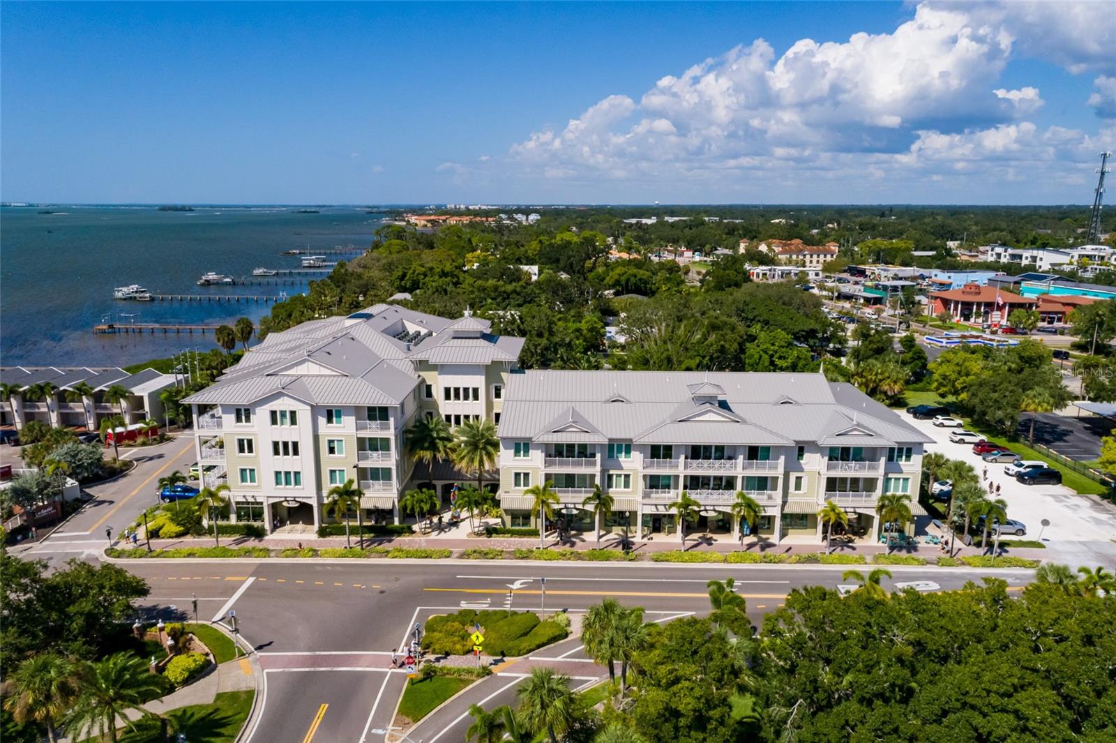 Experience luxury living in the heart of Downtown Dunedin at Victoria Place, the city’s premier condominium community. Perfectly positioned across from Edgewater Park, the marina, and the waterfront, this residence offers award-winning construction, maintenance-free living, and the security of a private, secure building.
This stunning second-floor remodeled condo has been upgraded throughout.   Natural light fills the open living spaces, creating an inviting and airy feel. The chef’s kitchen showcases a spacious island, designer cabinetry, quartz countertops, custom backsplash, under-cabinet lighting, and top-tier appliances. A stylish butler’s pantry with dual wine and beverage fridge adds both elegance and convenience.  Entertain with ease in the beautiful dining area and welcoming living room, which opens to a private patio—ideal for morning coffee or evening wine.  Two bedrooms and two full baths are thoughtfully designed with high-end finishes. The luxurious primary suite boasts enhanced crown molding, blackout window treatments, dual closets, and a spa-inspired en suite bath with an upgraded walk-in shower, glass enclosure, and modern vanity. The guest bedroom easily doubles as a home office or den. A dedicated laundry room with stackable washer/dryer adds everyday convenience.
Additional highlights include two assigned parking spaces in the secured owner’s parking area and a dedicated storage unit on the first floor. Victoria Place is part of Dunedin’s vibrant downtown with its restaurants, farmers market, breweries, boutique shops, and live music.
Opportunities to own in this sought-after community are rare—this is your chance to make it yours!
Seller open to considering an annual lease. If interested contact Listing Agent.