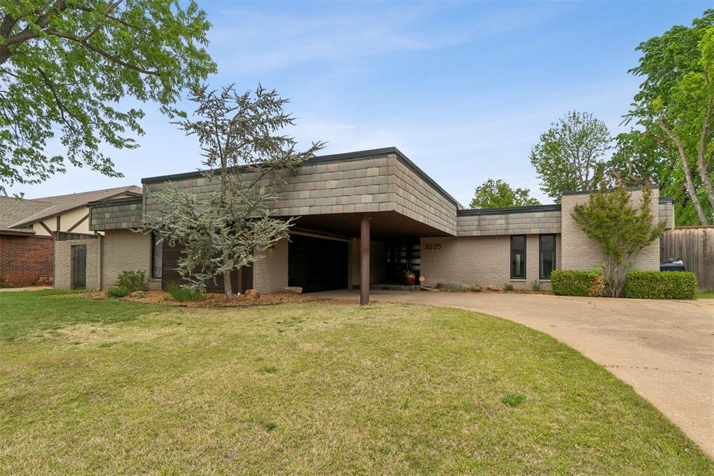 A MUST-SEE Mid-Century Modern home in Quail Creek on a highly sought-after street! This 4 bed, 2.5 bath home offers wonderful natural light, a glass double-door entry, and classic character with large windows throughout. The open living area features a beautiful slate fireplace and flows easily into the dining and kitchen spaces. The kitchen offers white cabinetry, an island with gas cooktop, double ovens, a built-in desk nook, and an eat-in dining area. A second dining space just off the kitchen provides even more room for entertaining and offers convenient access to the covered patio and fenced backyard. Three secondary bedrooms share a hallway bath, while the spacious primary suite features a large private bathroom and walk-in closet. With its open layout, abundant natural light, and multiple indoor and outdoor gathering spaces, this Quail Creek home is made for entertaining and everyday living!