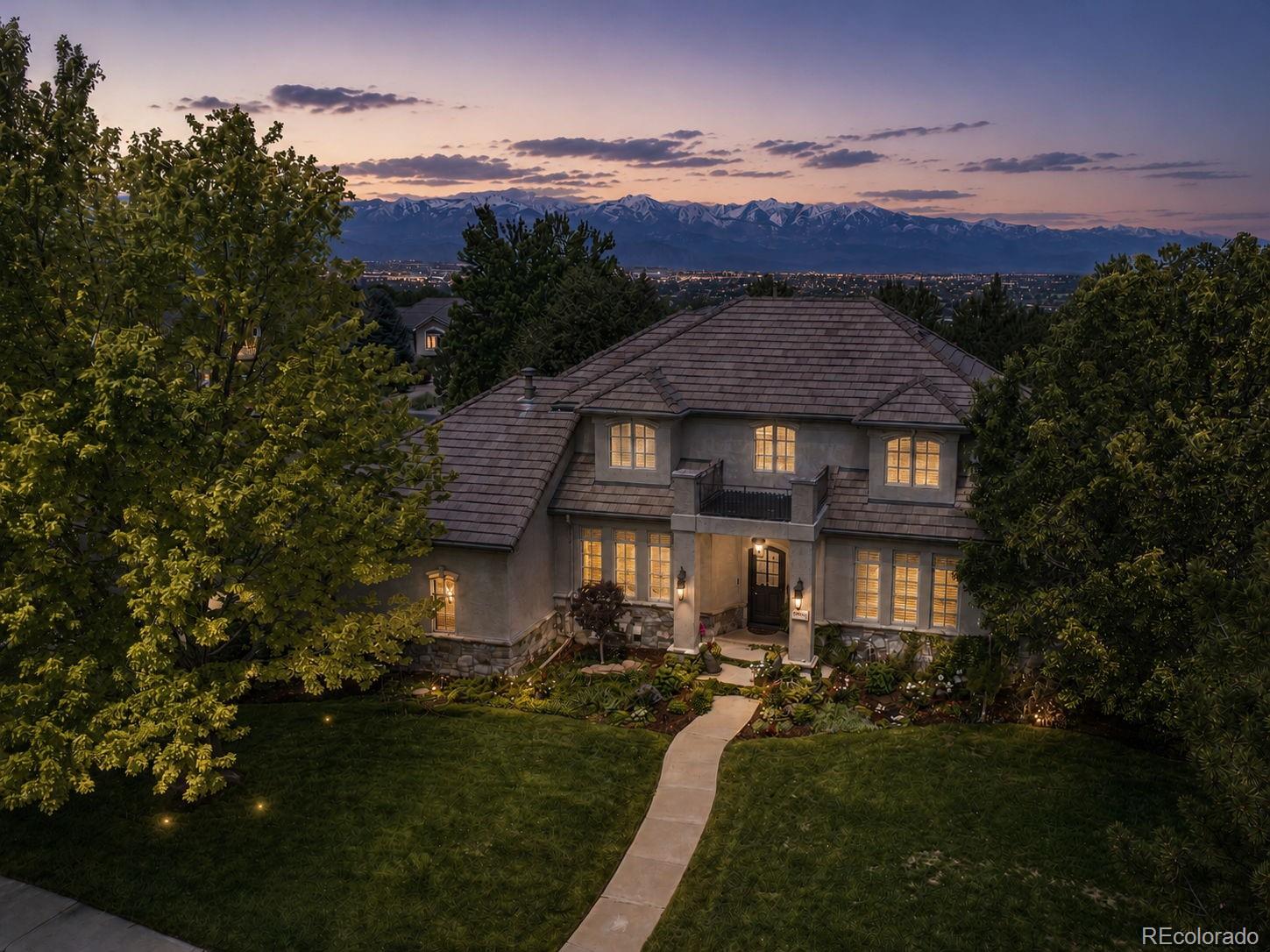 Situated within the exclusive gated Enclave of Legacy Ridge, one of Westminster's premier golf-course communities, this custom home offers over 6,200 SqFt of thoughtfully designed living space. Set on a large corner lot, this residence combines luxury, privacy, & an unmatched lifestyle. The beautifully updated kitchen serves as the heart of the home, featuring custom soft-close cabinetry, quartz countertops, panel-ready refrigerator, Frigidaire appliances, beverage refrigeration, butler's pantry, walk-in pantry, banquet seating w/ storage, oak hardwood flooring, & a fireplace. Cased windows, built-in speakers, & a private courtyard create an inviting atmosphere for entertaining. Throughout the home you'll find oak hardwood flooring, plantation shutters, crown molding, solid-core doors, built-in speakers, Sonos audio, & exceptional timeless millwork. Formal living & dining rooms provide elegant entertaining spaces, while the main-floor primary suite offers hardwood floors, an ensuite office, custom California Closet system, & a stunning spa-inspired bath w/ heated floors. Upstairs are 2 spacious bedrooms w/ new wool carpeting, walk-in closets, window seats w/ storage, connected by a Jack-&-Jill bath w/ separate vanities. An additional bedroom with a private ensuite completes the upstairs. The walkout basement is designed for entertaining w/ a large recreation room featuring surround sound, built-ins, gas fireplace, wet bar, steam shower, 2 additional bedrooms, cedar-lined closet, safe room, & storage. Outdoor amenities include a sport court, covered patio plumbed & wired for a future hot tub, outdoor speakers & security cameras, mature landscaping, newer deck w/ gas line for grilling, & outdoor gathering spaces. Additional highlights include a main-floor laundry room, 3-car garage w/ epoxy floors & built-in storage, newer water heaters/AC units/furnaces, concrete tile roof, & 2 gas fireplaces. You can own one of Legacy Ridge's most distinctive homes.
