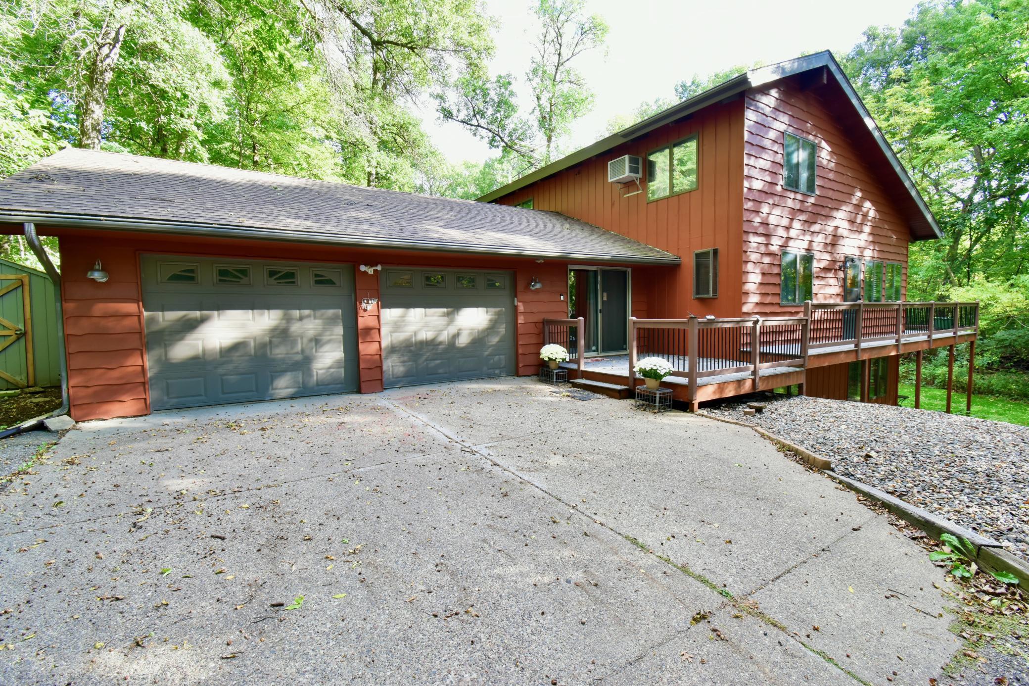 Nestled at the end of a quiet cul-de-sac with no through traffic, this highly desirable location offers the perfect balance of serene, private living and close-to-town convenience. Surrounded by towering trees, the property features a maintenance-free wrap-around deck with sweeping views of your own private forest bordering over 100 acres of peaceful farmland.Inside, a bright and inviting kitchen comes equipped with stainless steel appliances and a spacious walk-in pantry. The sunlit lower level is fully equipped as an independent in-law suite complete with its own kitchenette. You'll also find a versatile bonus room—ideal for a fourth bedroom, home office, exercise room, or extra media space.Key Features & Recent Upgrades:*3–4 Bedrooms / Flexible Layout: Includes a full lower-level in-law suite and adaptable bonus room.*Modern Kitchen: Stainless steel appliances and a walk-in pantry.*Outdoor Oasis: Wrap-around maintenance-free deck overlooking a private wooded setting next to 100+ acres of farmland.*New Roof (2025): Professionally installed for lasting peace of mind.*New Flooring (2026): Fresh, updated flooring throughout the entire home.*Comfort & Convenience: Dual heating systems and a reverse osmosis system for clean drinking water.   Come check it out today!