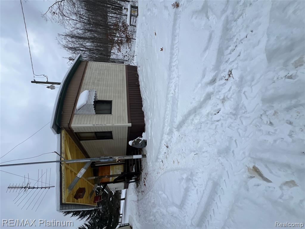 This 40-acre hunter's paradise features a 14 x 60 mobile home with an additional 200 sq. ft. living room, offering 2 bedrooms and 1 bathroom, complete with a washer and dryer. Key amenities include electricity, a furnace, a woodstove, a 4-inch well, a septic system with a drain field, and a new Generac generator set to be installed in 2025. The property measures 1,320 feet by 1,320 feet and boasts established trails winding through rolling hills, with a picturesque mix of mature hardwoods such as oak, pine, and maple trees. The site is ideal for hunting, with 3 deer blinds and tree stands already set up, making it a prime spot for bear, turkey, partridge, and white-tailed deer. Additionally, the 14 x 26 garage, built in 2021, is equipped with electricity. The current owners have cherished and utilized this property throughout the year.